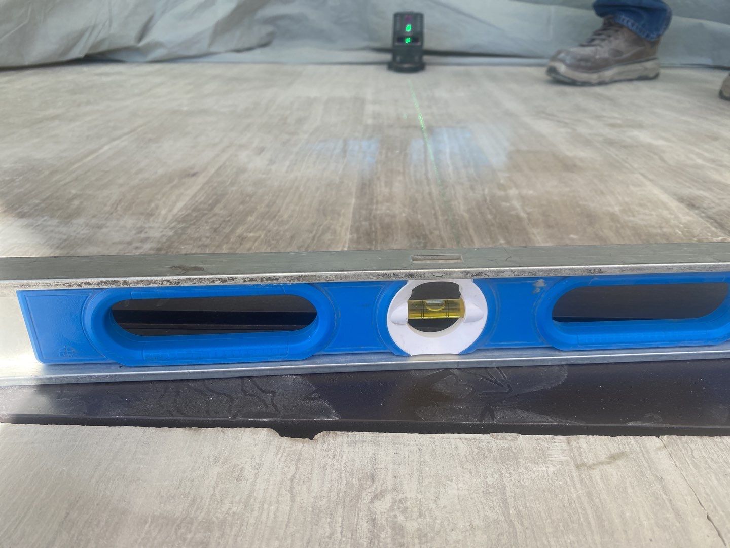 Custom Material Pivot Door installation by Impact Precious Wood Inc.