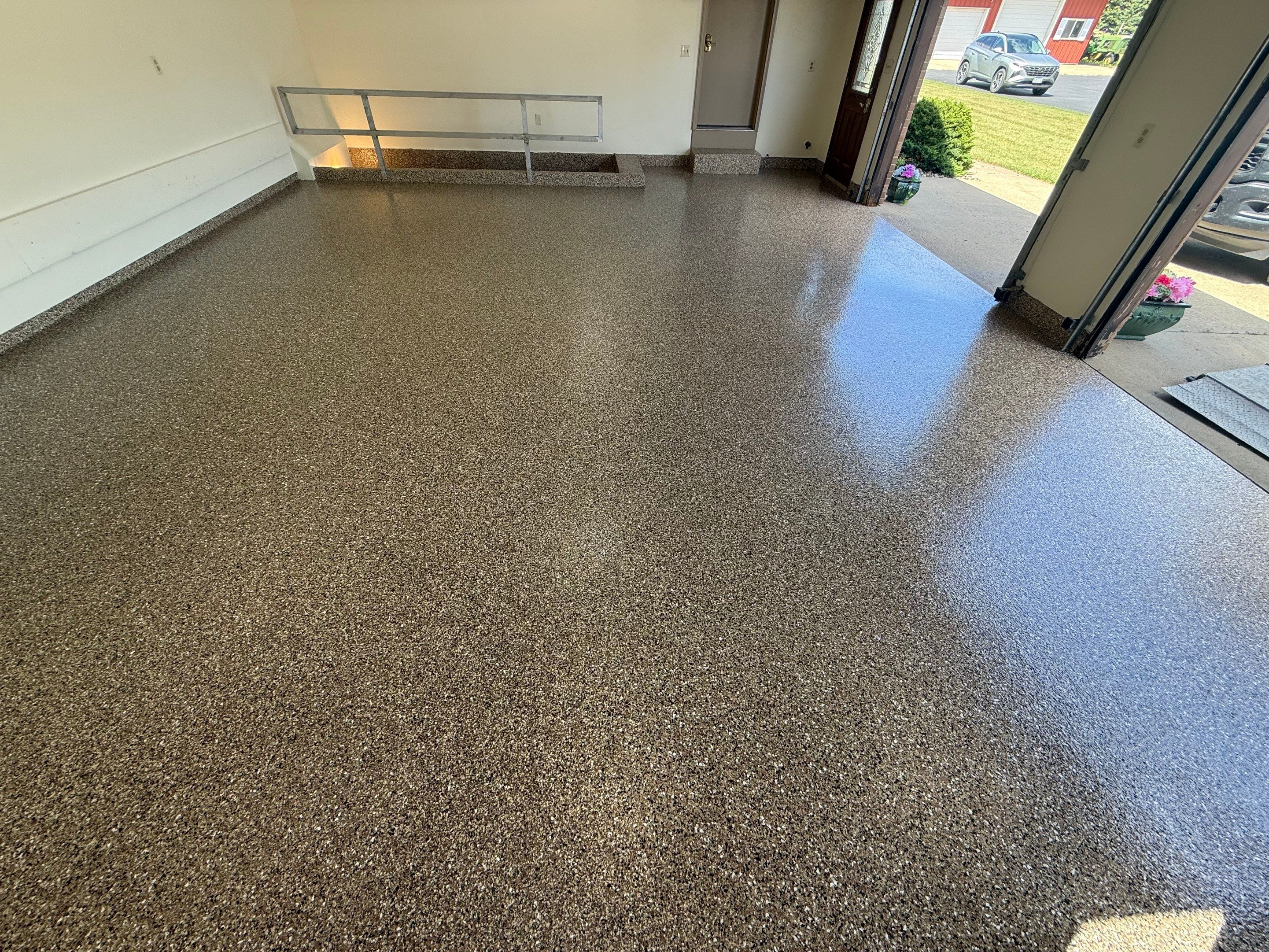 Custom Polyaspartic Garage Floor and Stairwell Coating in Pipestone by Select Painting, Coatings & Garage Cabinets