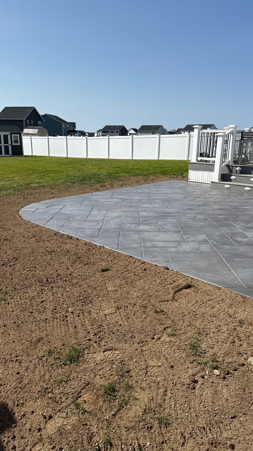 Majestic Ashlar stamped concrete patio  by NG Masonry & Construction LLC