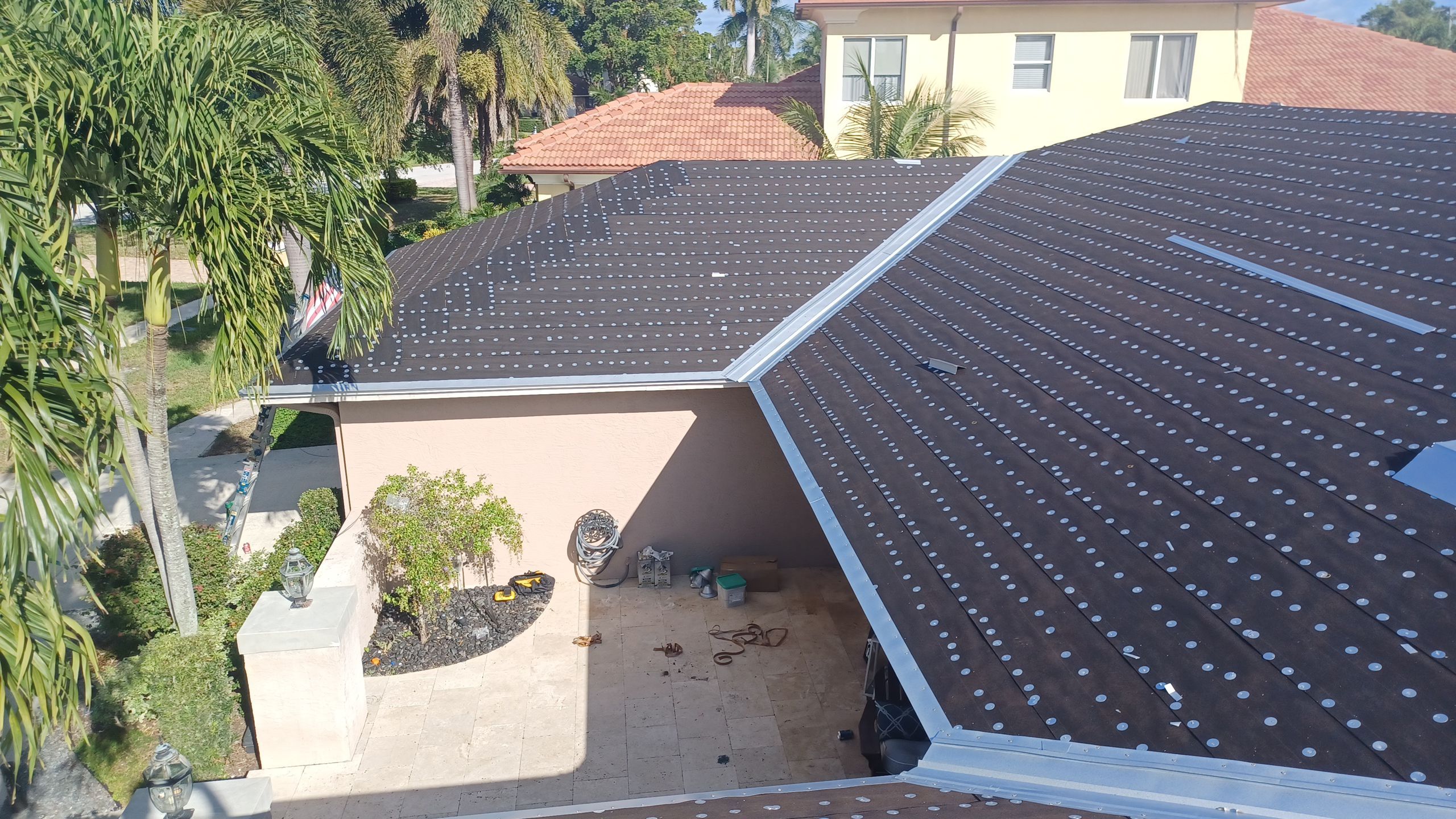 Residential Roofing Installation using 1" Nail strip metal roof by BLUES BROTHERS CONSTRUCTION CORP