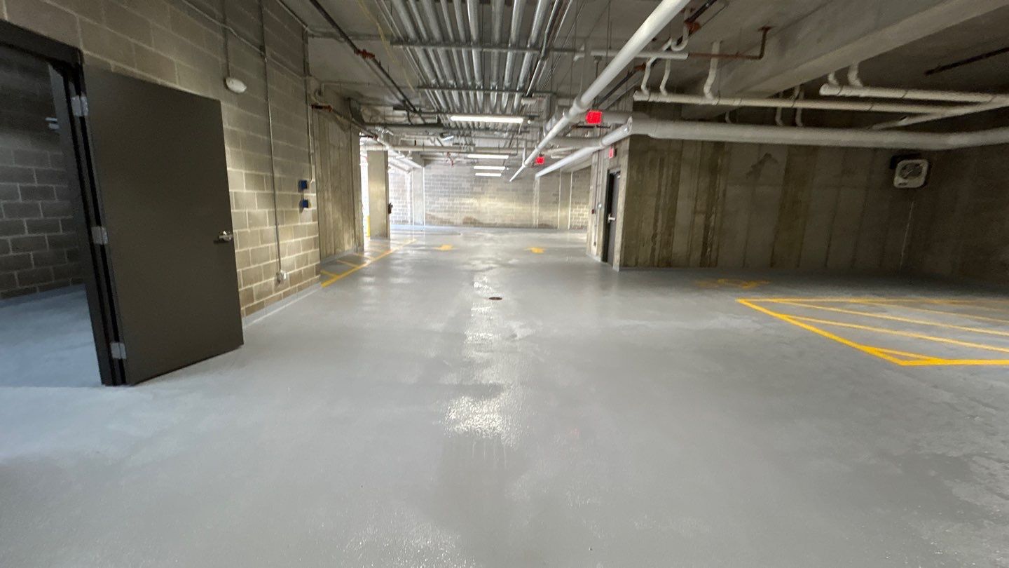 Parking garage using Hot water by Northern Power Washing LLC.