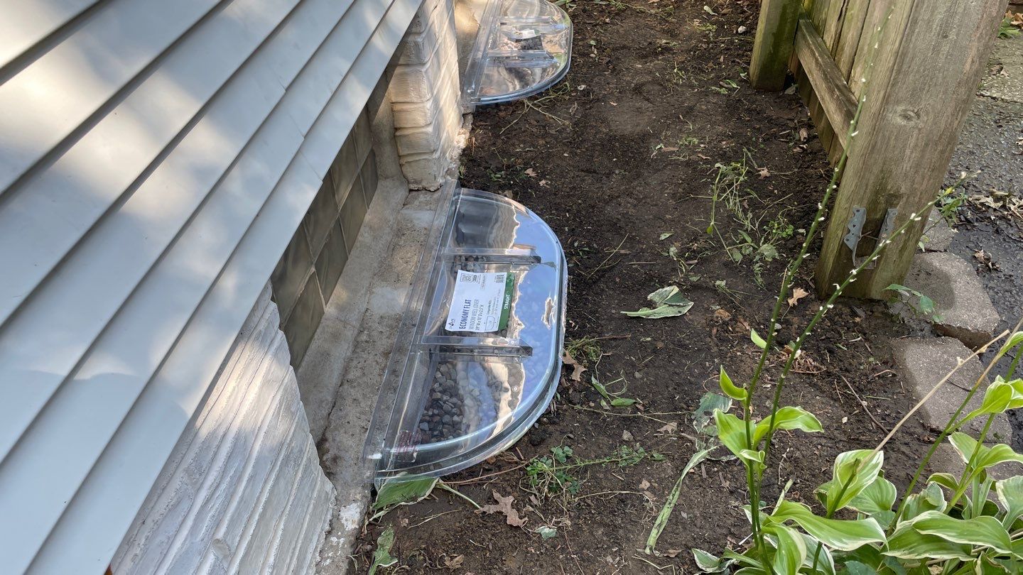 Drain Tile, Window Wells & Buried Discharge in Minneapolis by Waterproofing Northeast