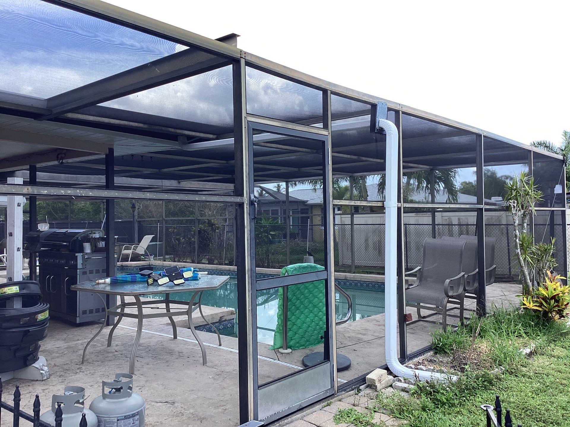 White Seamless Gutters and Splash Guards in Fort Myers FL by Gutter Professor by Gutter Professors