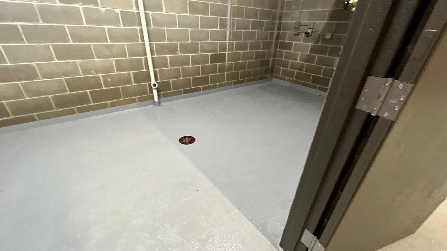 Parking garage using Hot water by Northern Power Washing LLC.
