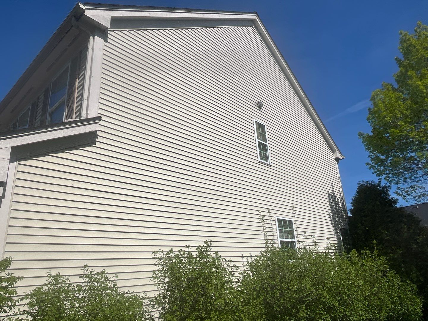 Housewashing  using Algaecide, soft wash soap by Northern Power Washing LLC.