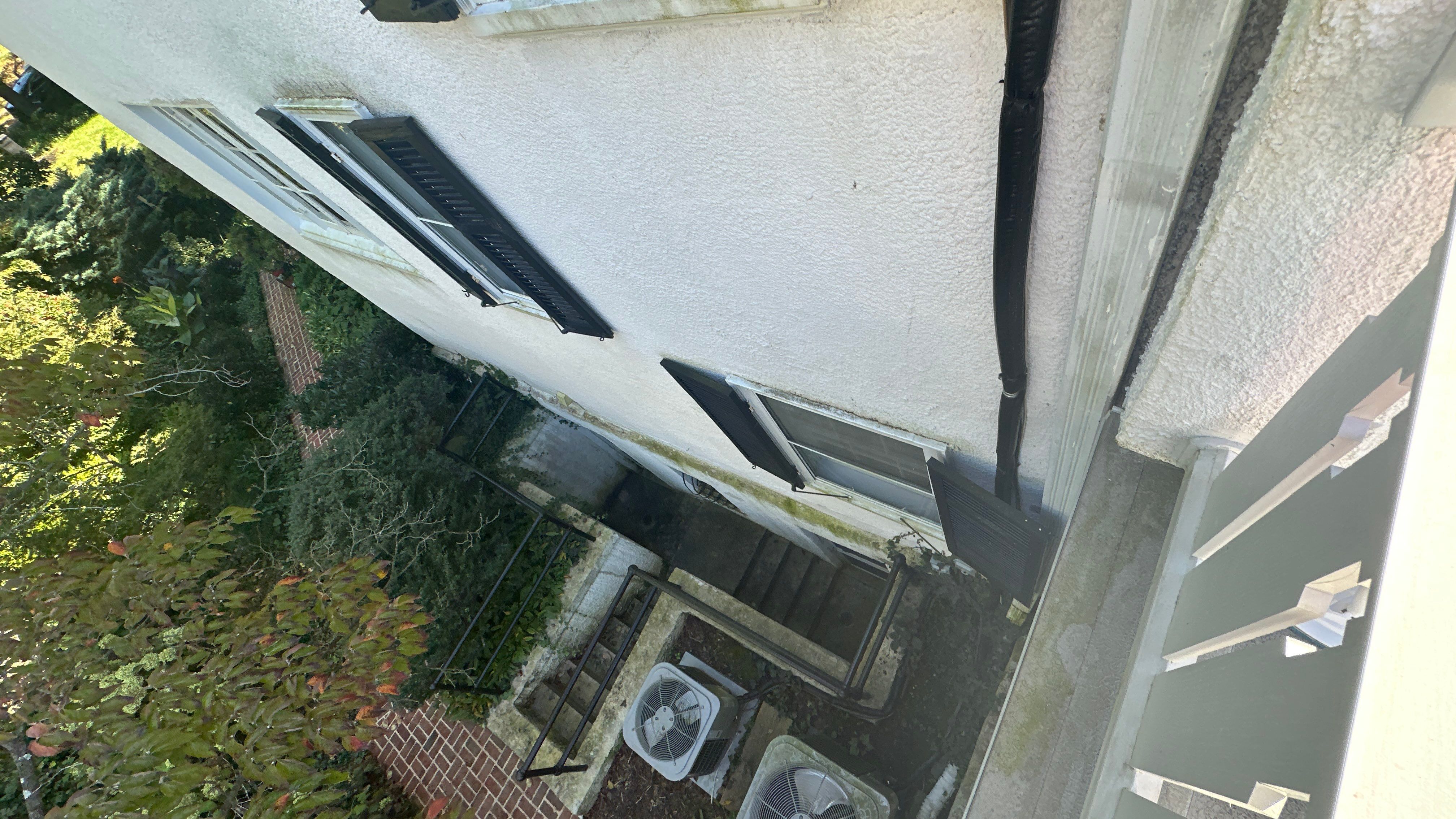 Stucco House Washing and Concrete Balcony Cleaning in Baltimore by Baltimore Pressure Washers Inc.