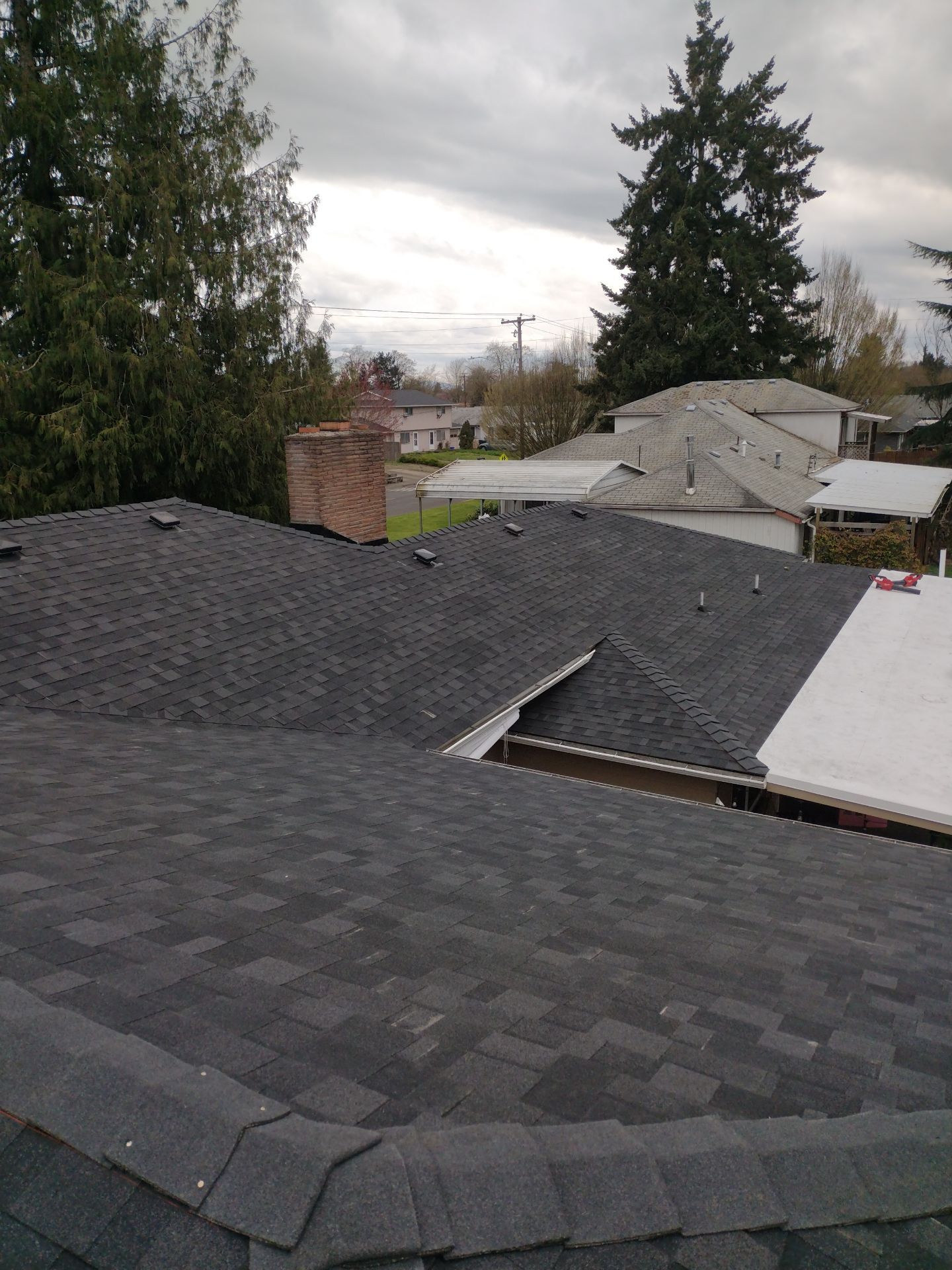 Residential Roofing Installation using IKO Dynasty (Color: Granite Black) by Orezona Building & Roofing Company, Inc.