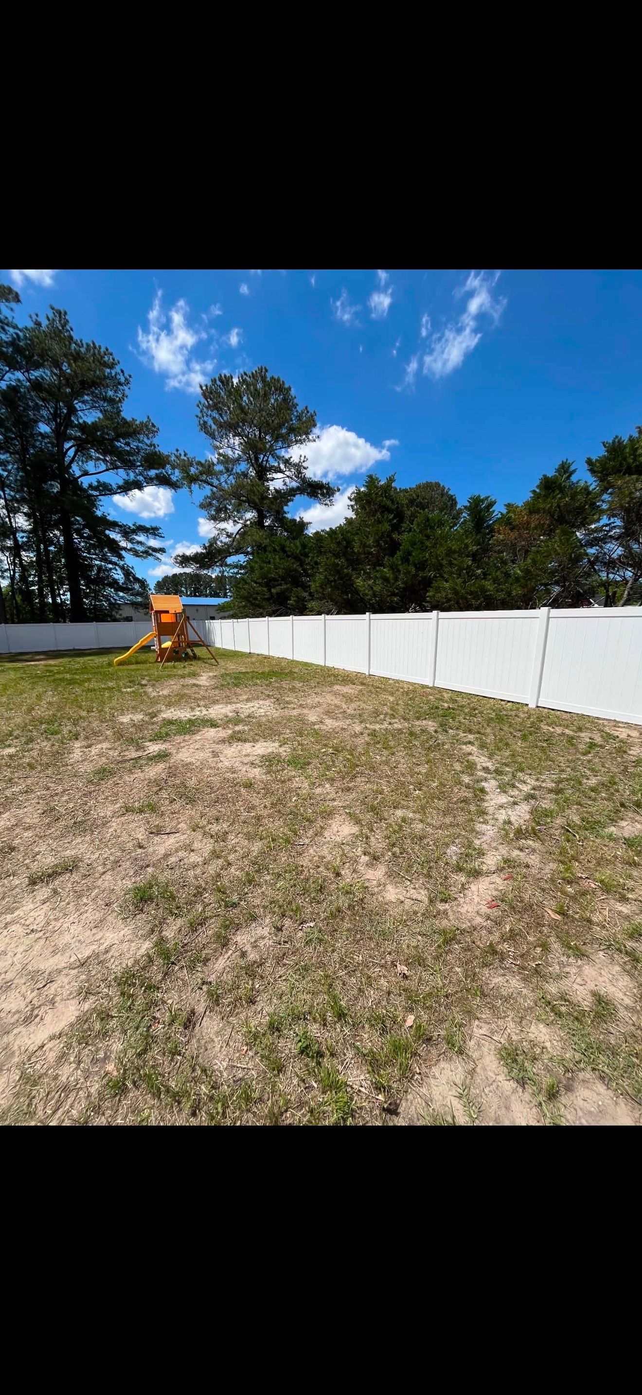 White Vinyl Privacy Fence with Solar Post Caps in Goldsboro by Superior Fence and Rail