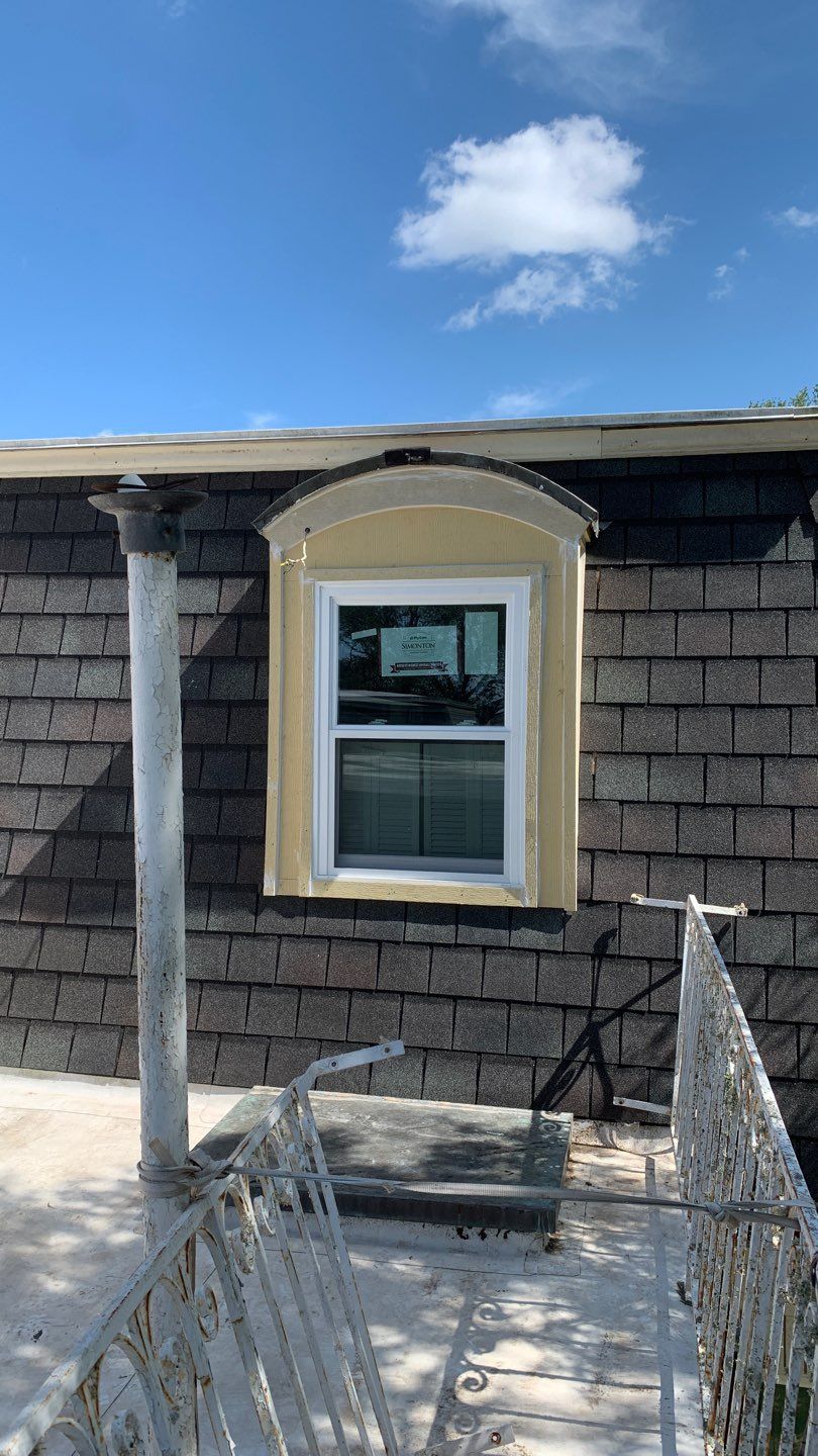 Mansard Charm by Bayfront Roofing and Construction