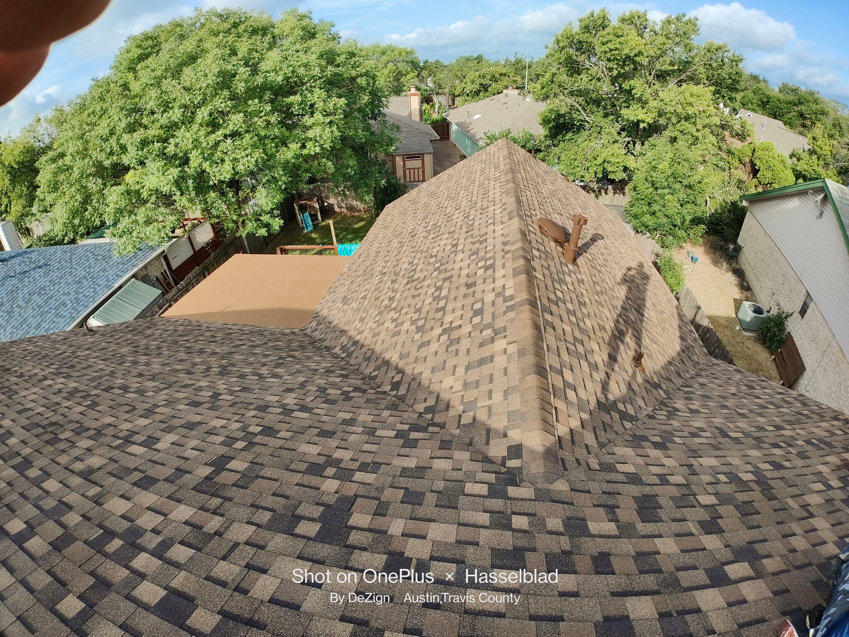 New Roof Installation Of IKO Dynasty Color Brownstone by DeZign Roofing & Exteriors