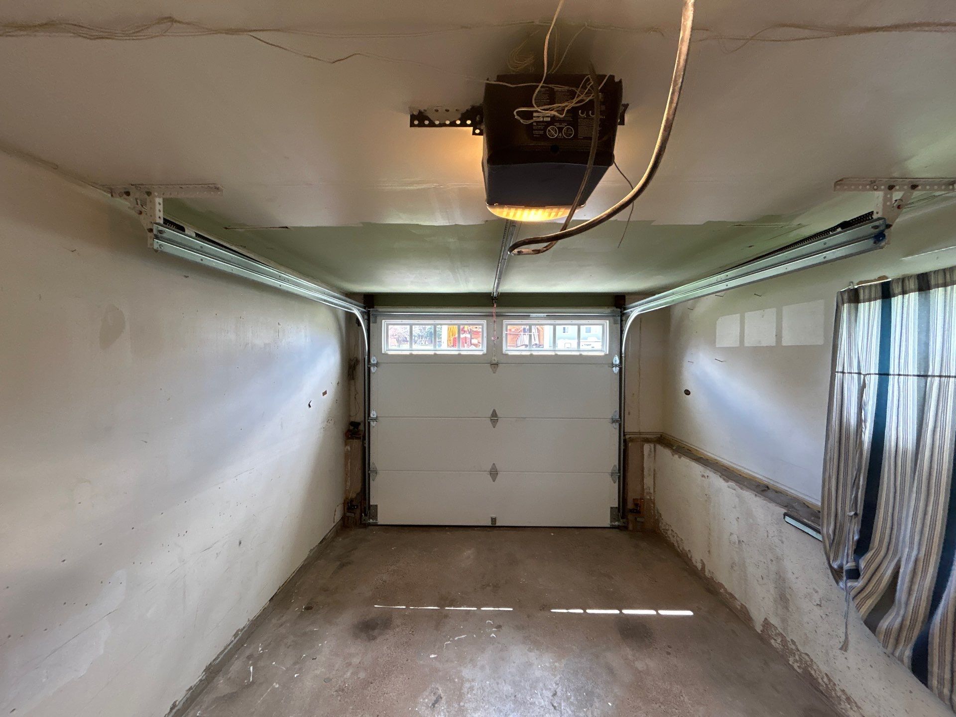 Classic Garage Door Upgrade with Refined Detail by DiGiorgi Roofing and Siding Inc