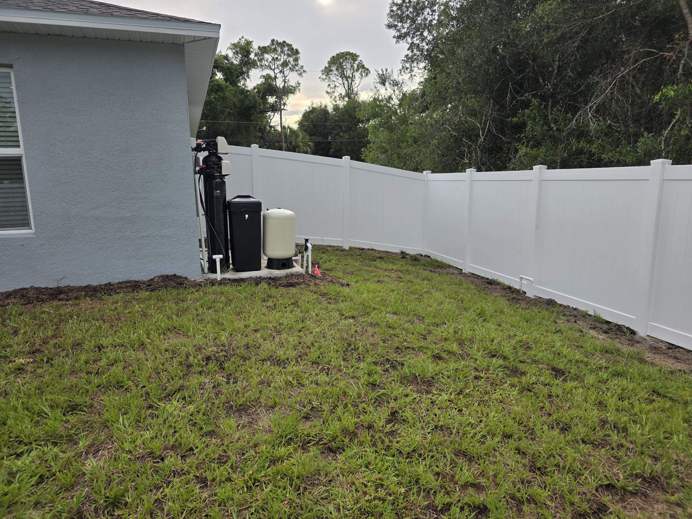White Vinyl Privacy Fence with Gate Installation in North Port by True Fence LLC