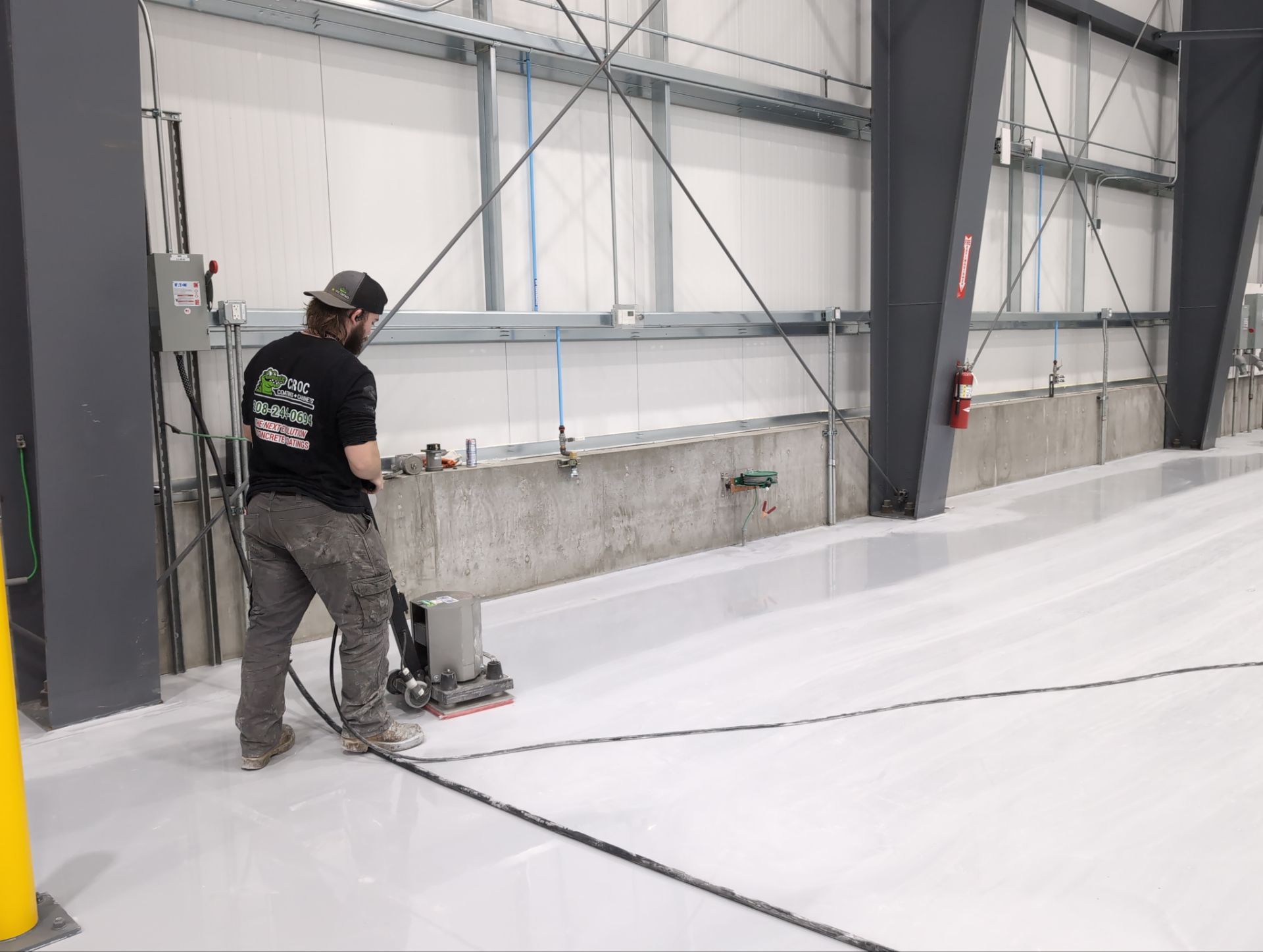 Airplane Hanger using Light Grey Commercial Penntek Epoxy by Croc Coatings, LLC