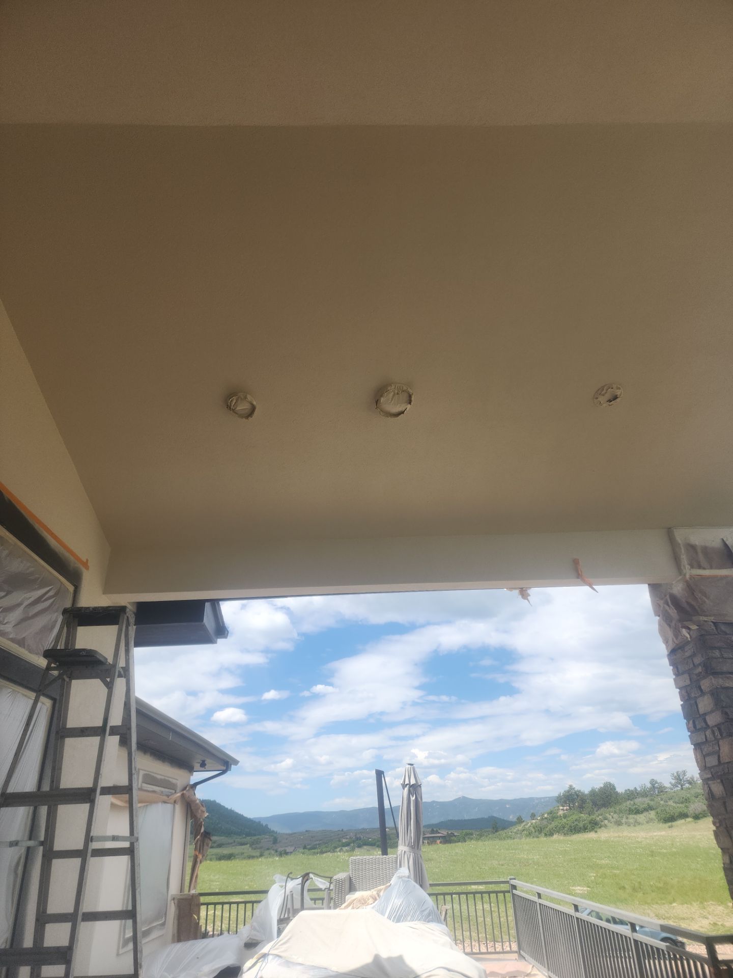 Castle Rock Elegance: White Stucco Exterior with Bold Tricorn Black by J&M Painting LLC
