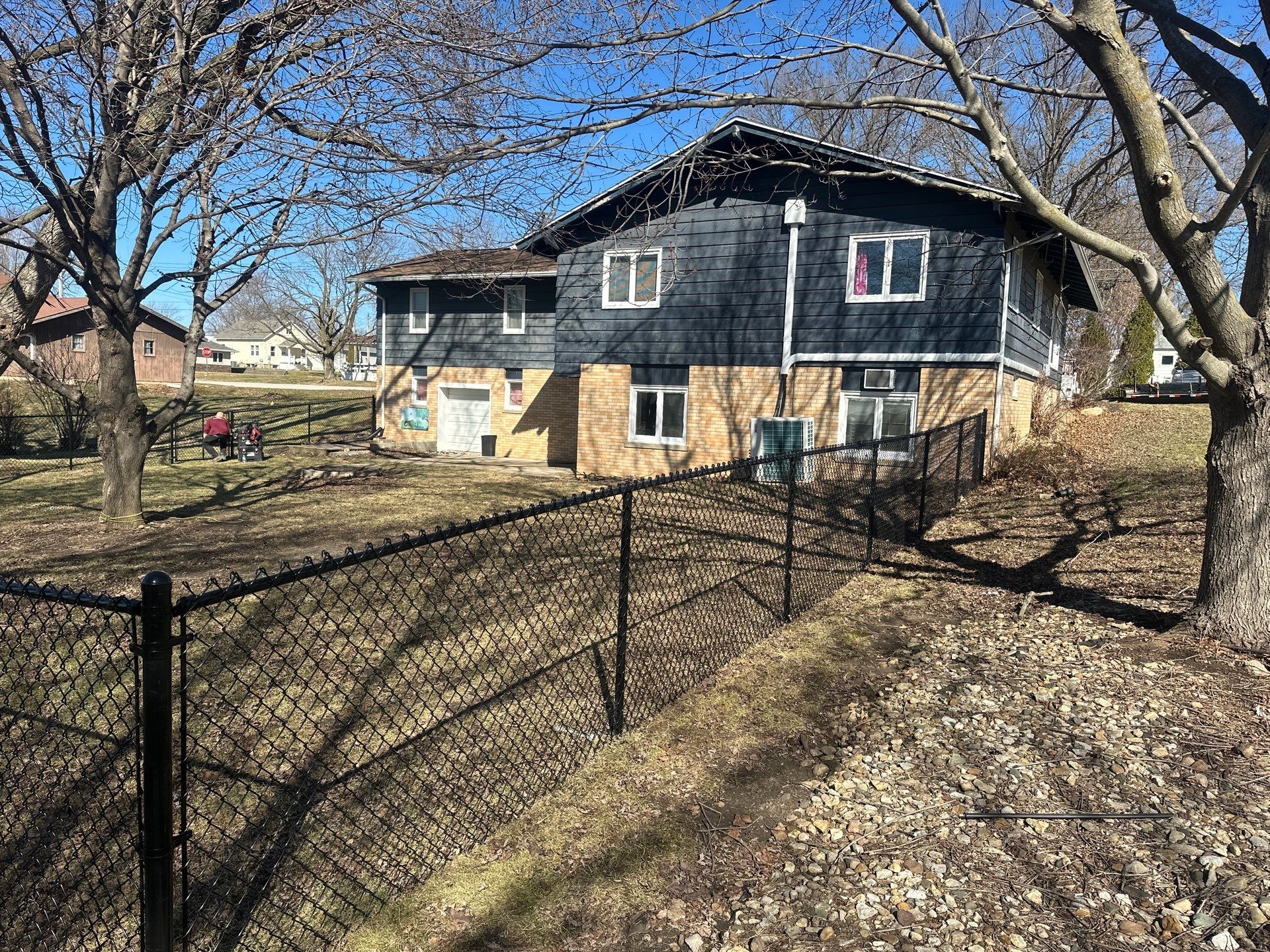 Black Chain Link Fence Installation with Double Gate in Grundy Center by Perfect Picket Fence and Stain