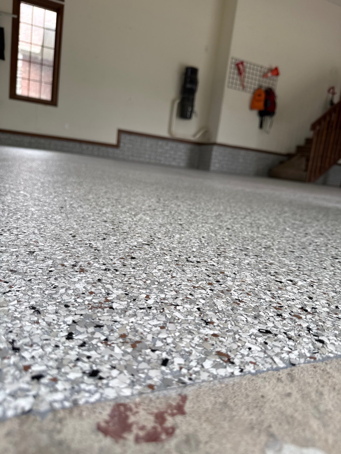 Coyote Flake Epoxy Garage Floor Coating in Earlham by Revival Concrete Coatings