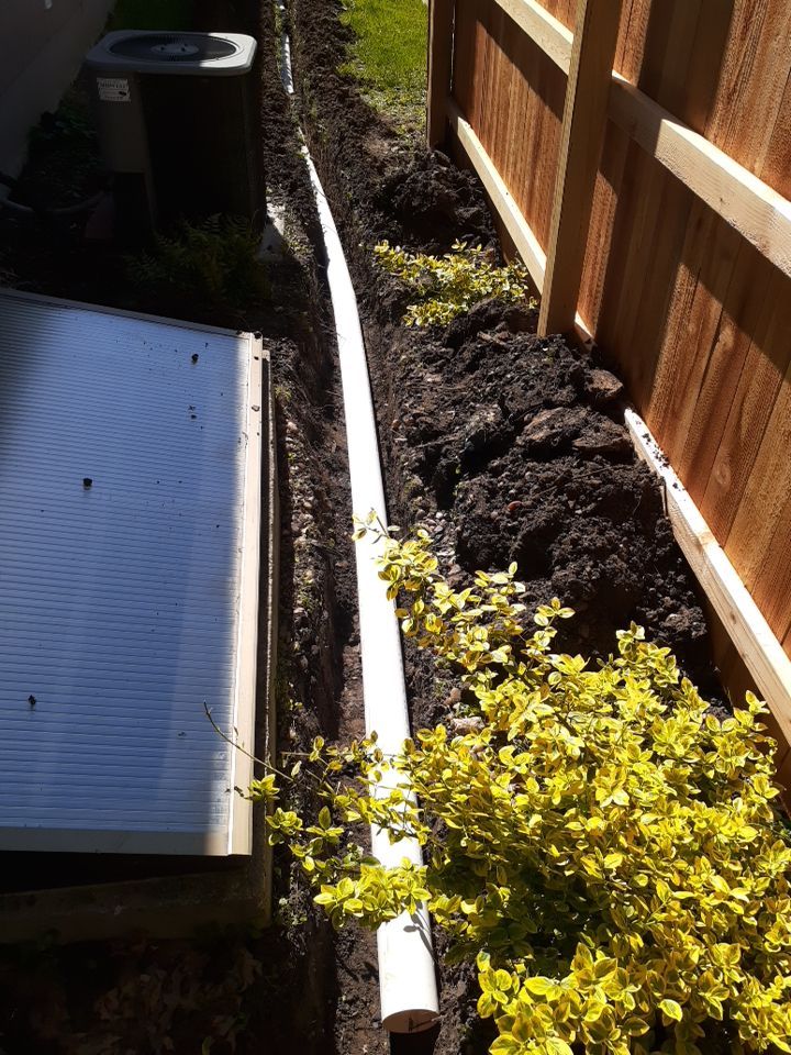 Drainage and Downspout Installation by LAND ESCAPES LLC