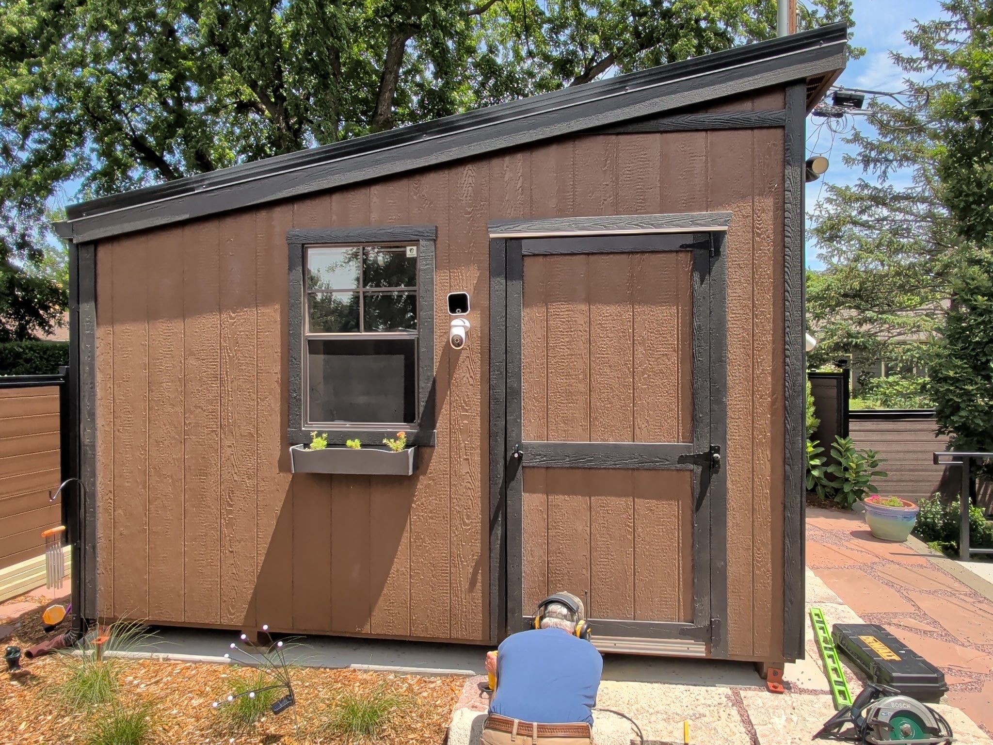 Modern Shed Construction with Stone Foundation in Sioux Falls by Select Painting, Coatings & Garage Cabinets