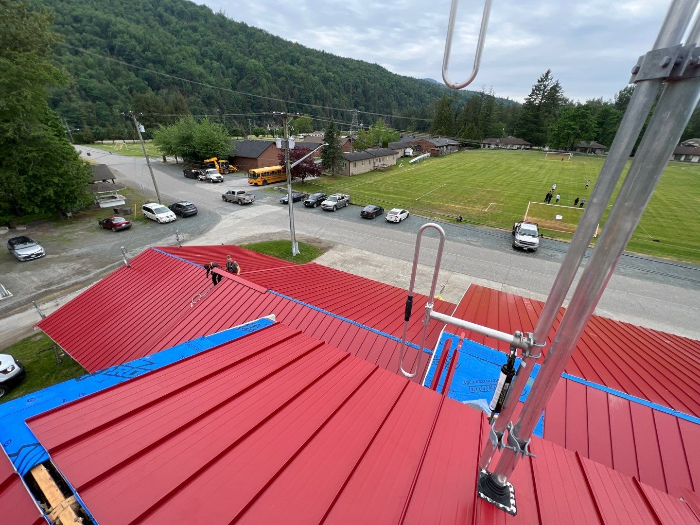 Commercial Roofing Installation using 12" Prolok metal  by Top Notch Roofing Inc