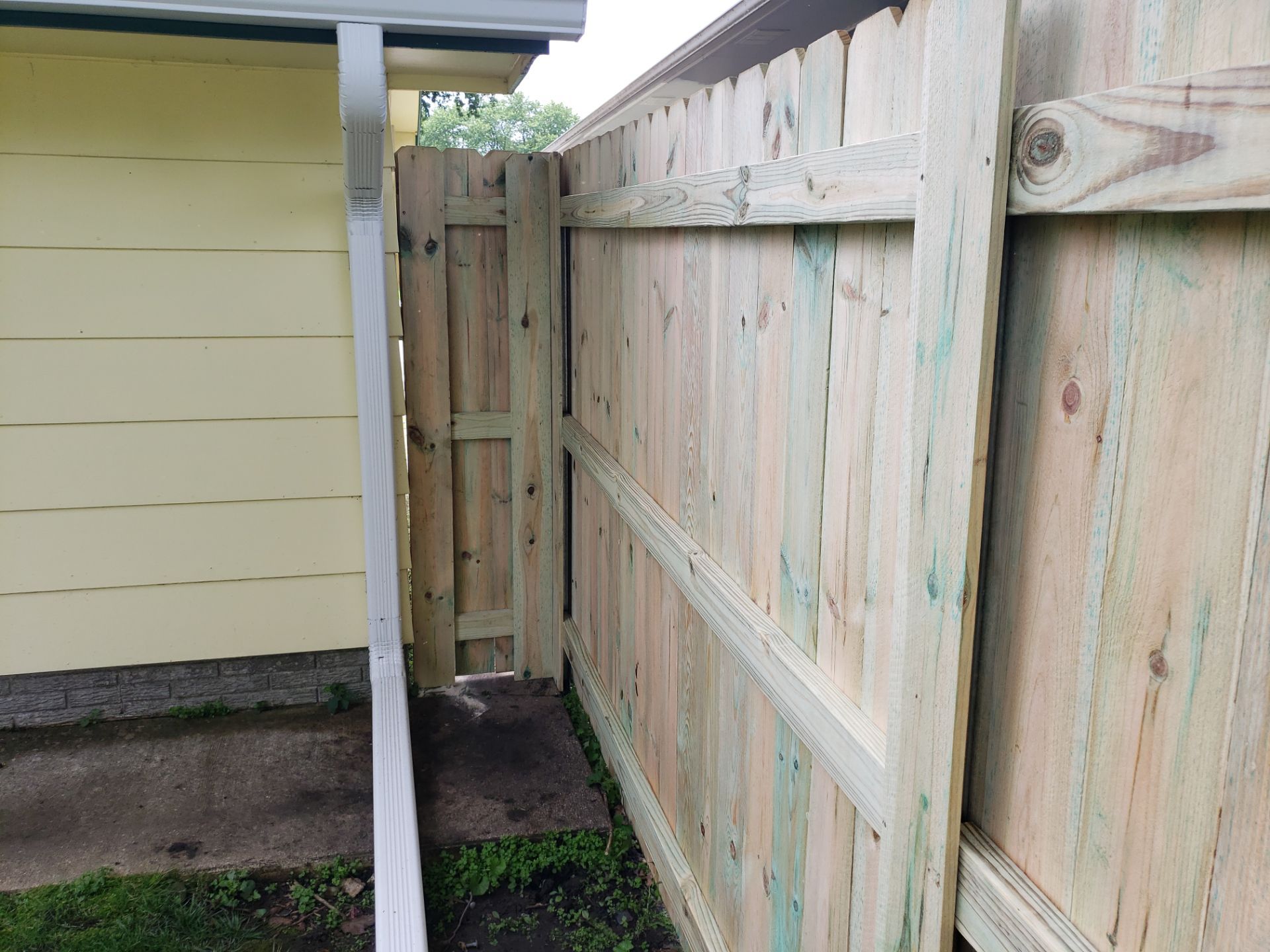 Custom Wood Privacy Fence Installation for Charles City Backyard by Perfect Picket Fence and Stain