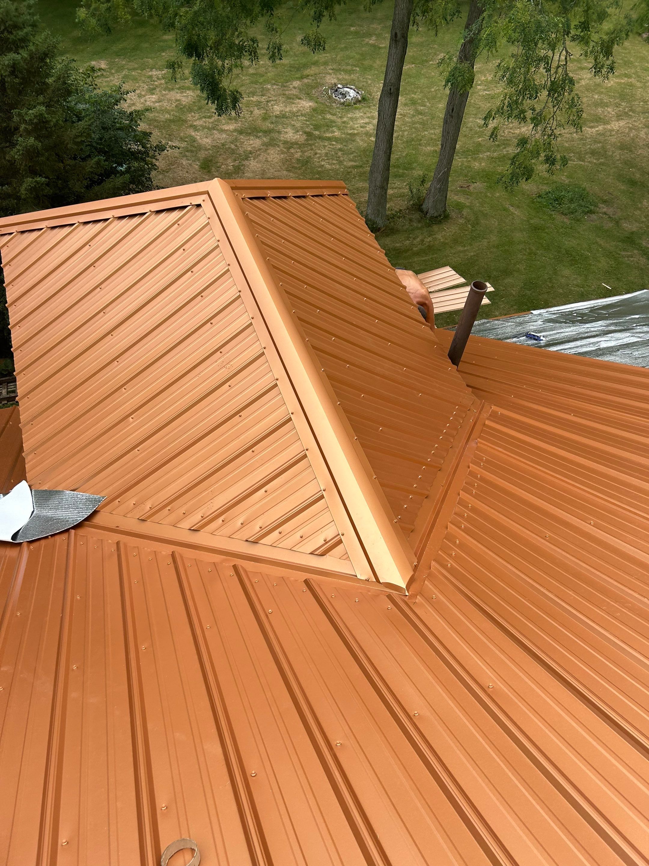 Residential Roofing Installation using Performance Panel Metal - Copper Metallic by RoofX 