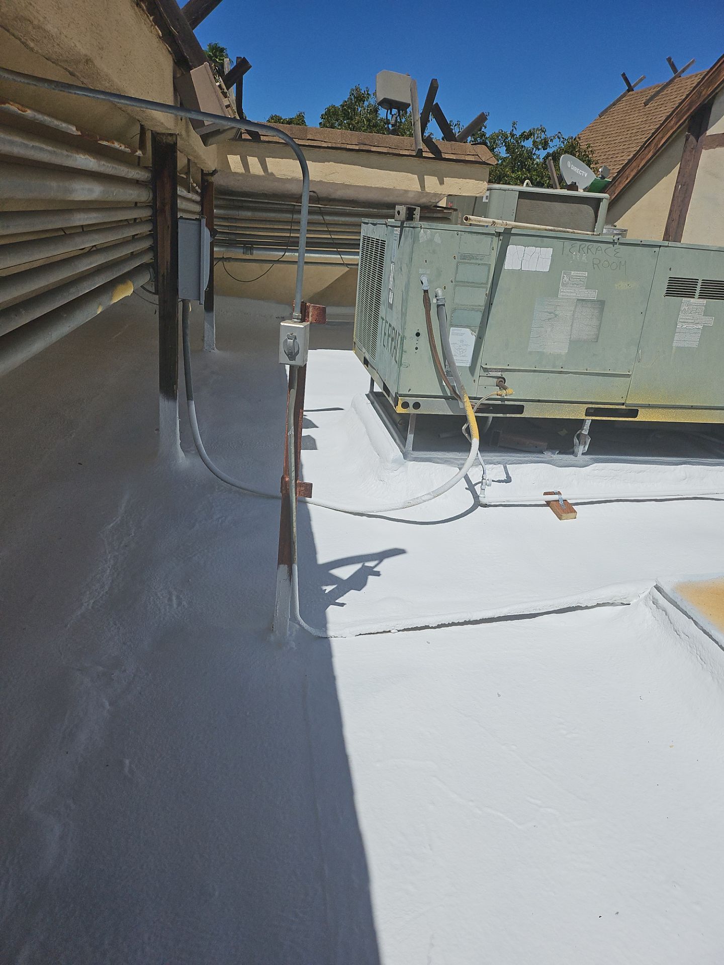 Spray foam and coatings using General Coatings acrylic coatings and spray foam by Straight Edge Roofing Inc