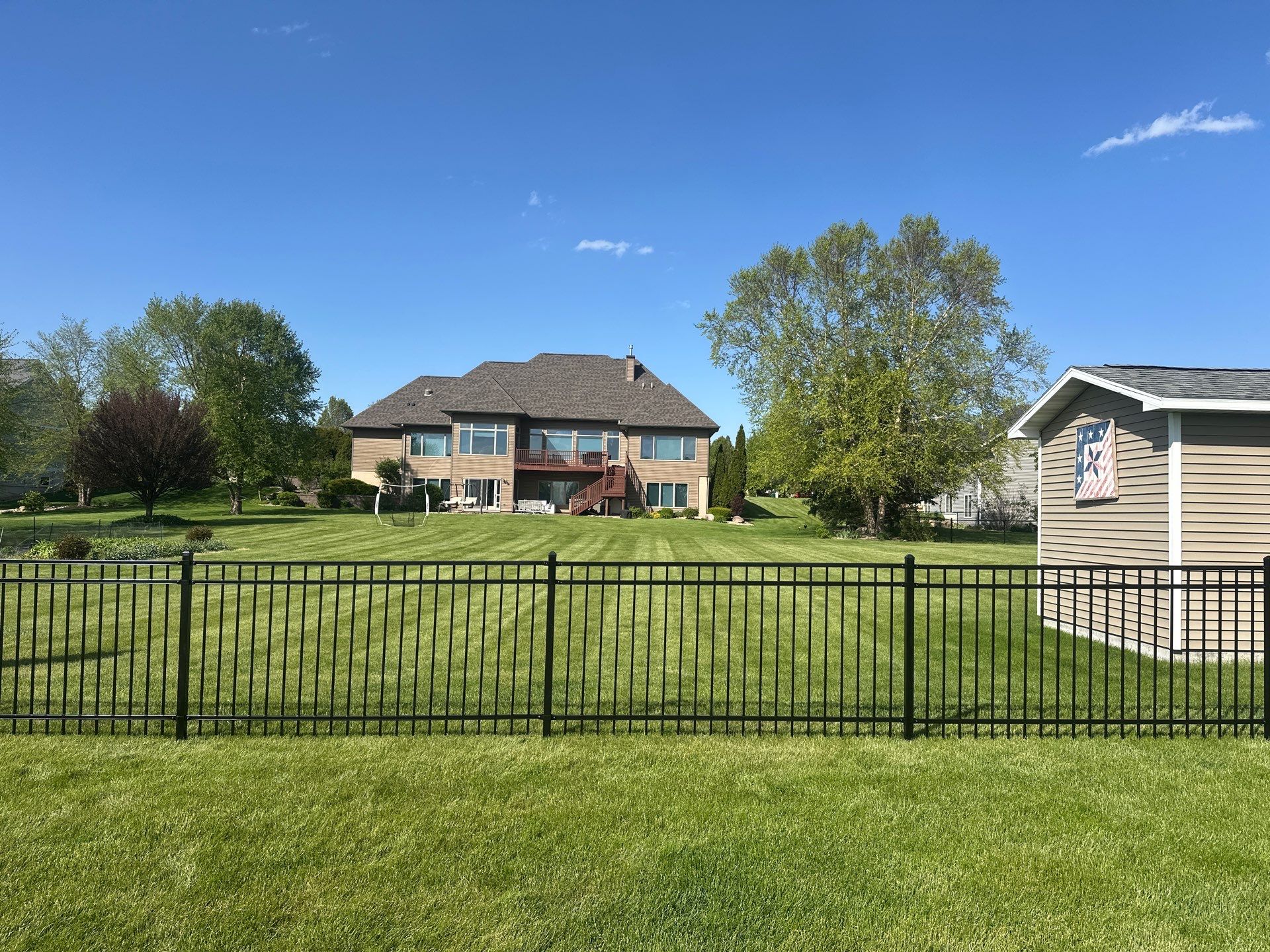 Black Ornamental Metal Picket Fence Installation in Waterloo by Perfect Picket Fence and Stain