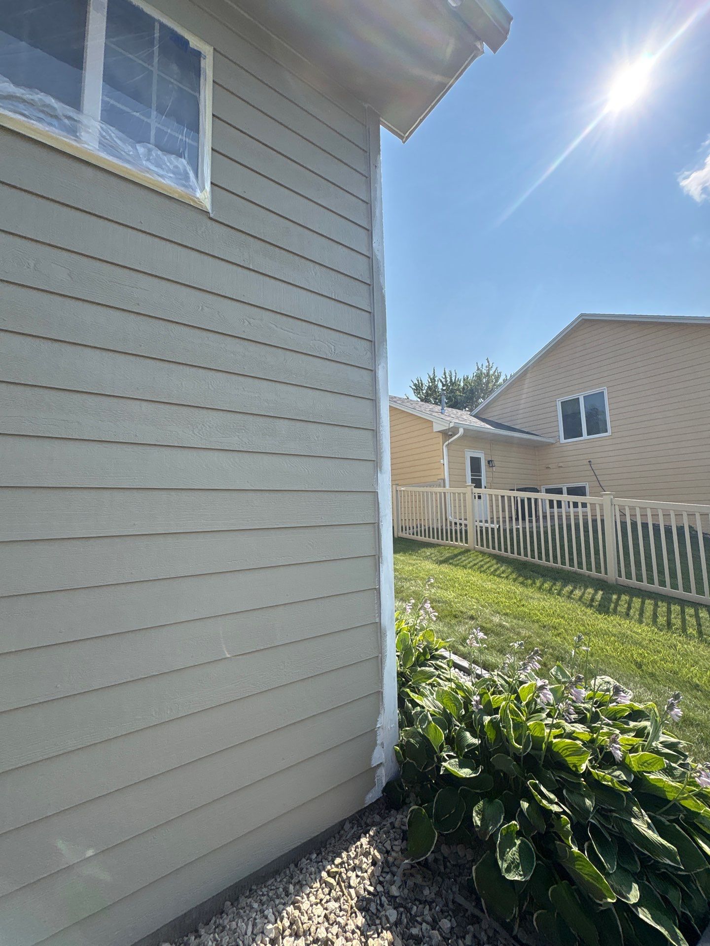 Residential Exterior Painting and Siding Refresh in Sioux Falls by Select Painting, Coatings & Garage Cabinets