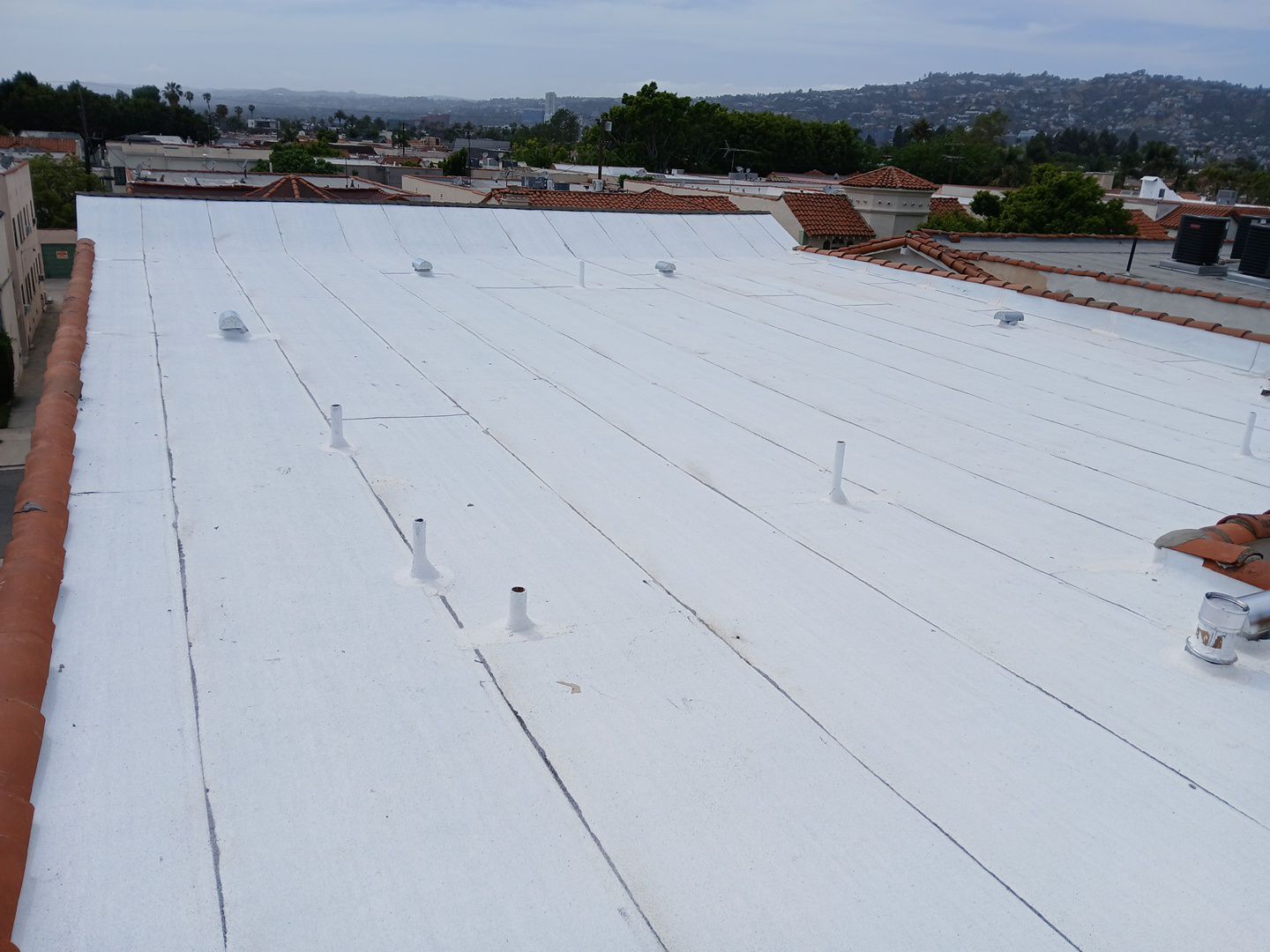 Apartment Building Reroofing using Polyfresko® G Highly Reflective Modified Bitumen Cap Sheet by Hull Brothers Roofing