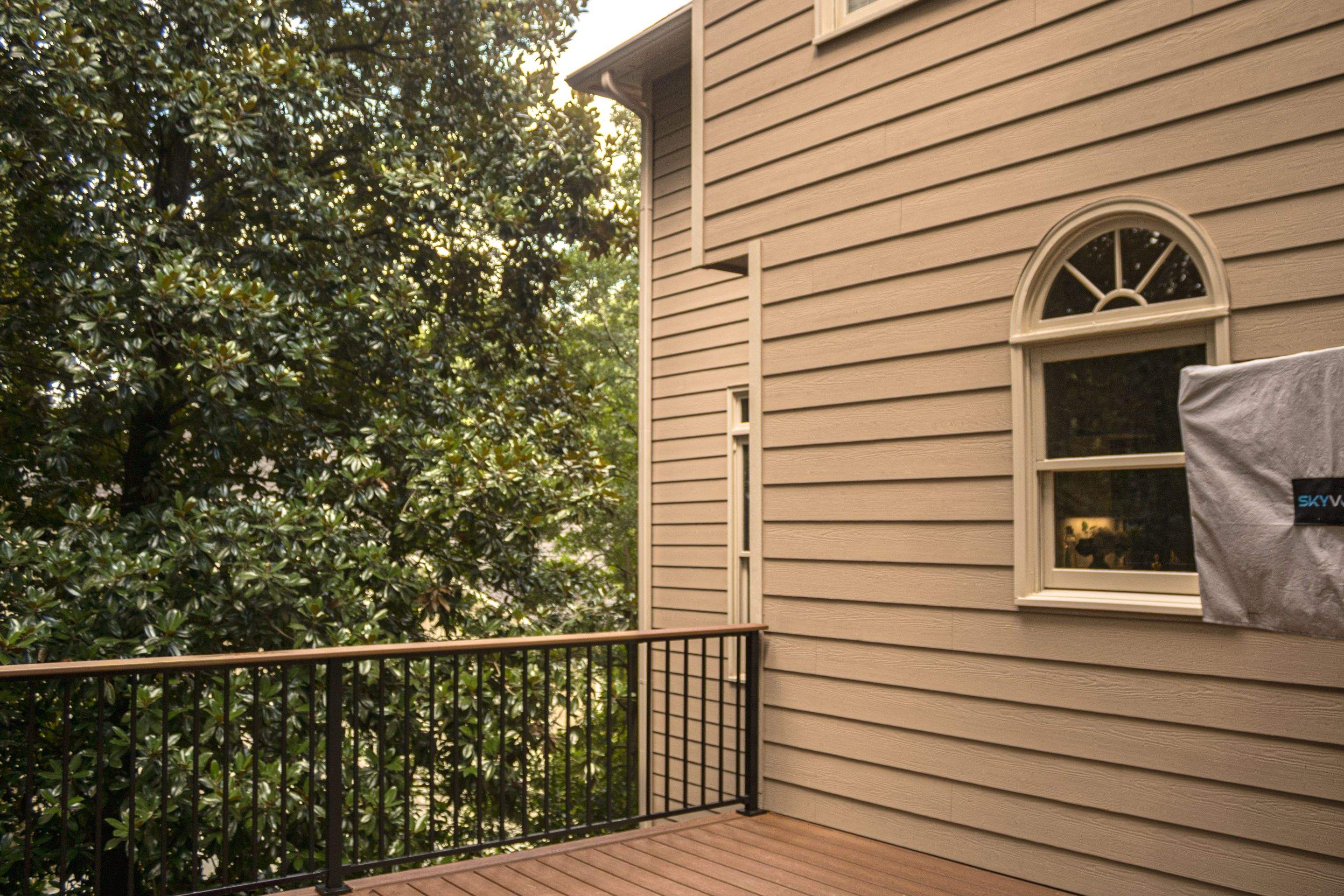 Full James Hardie Siding Replacement and Trex Deck Resurface in the Saddle Color by Nelson Exteriors 