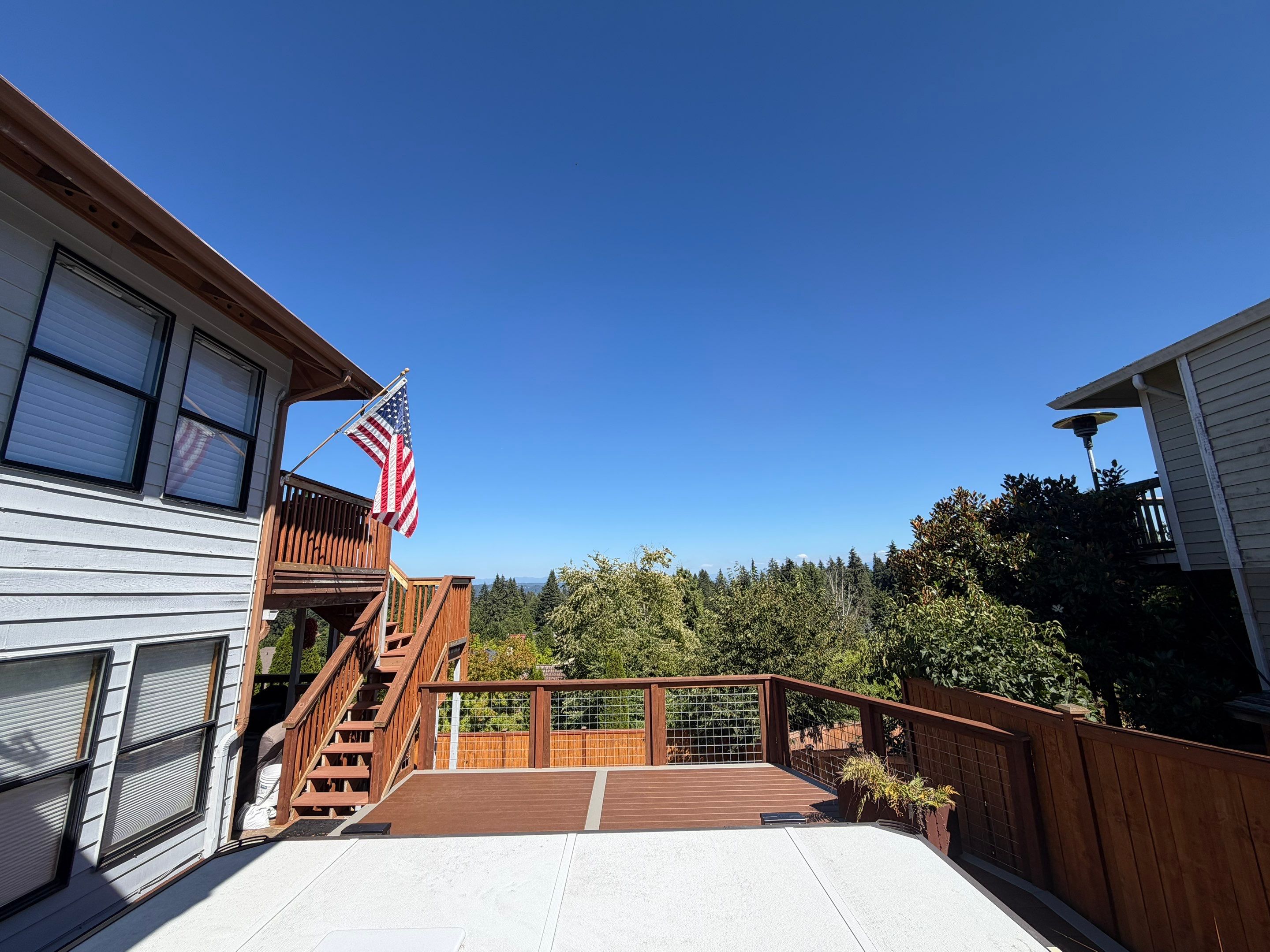 Tacoma Custom Composite Deck and Hot Tub Surround with Retaining Wall by Emerald City Energy 