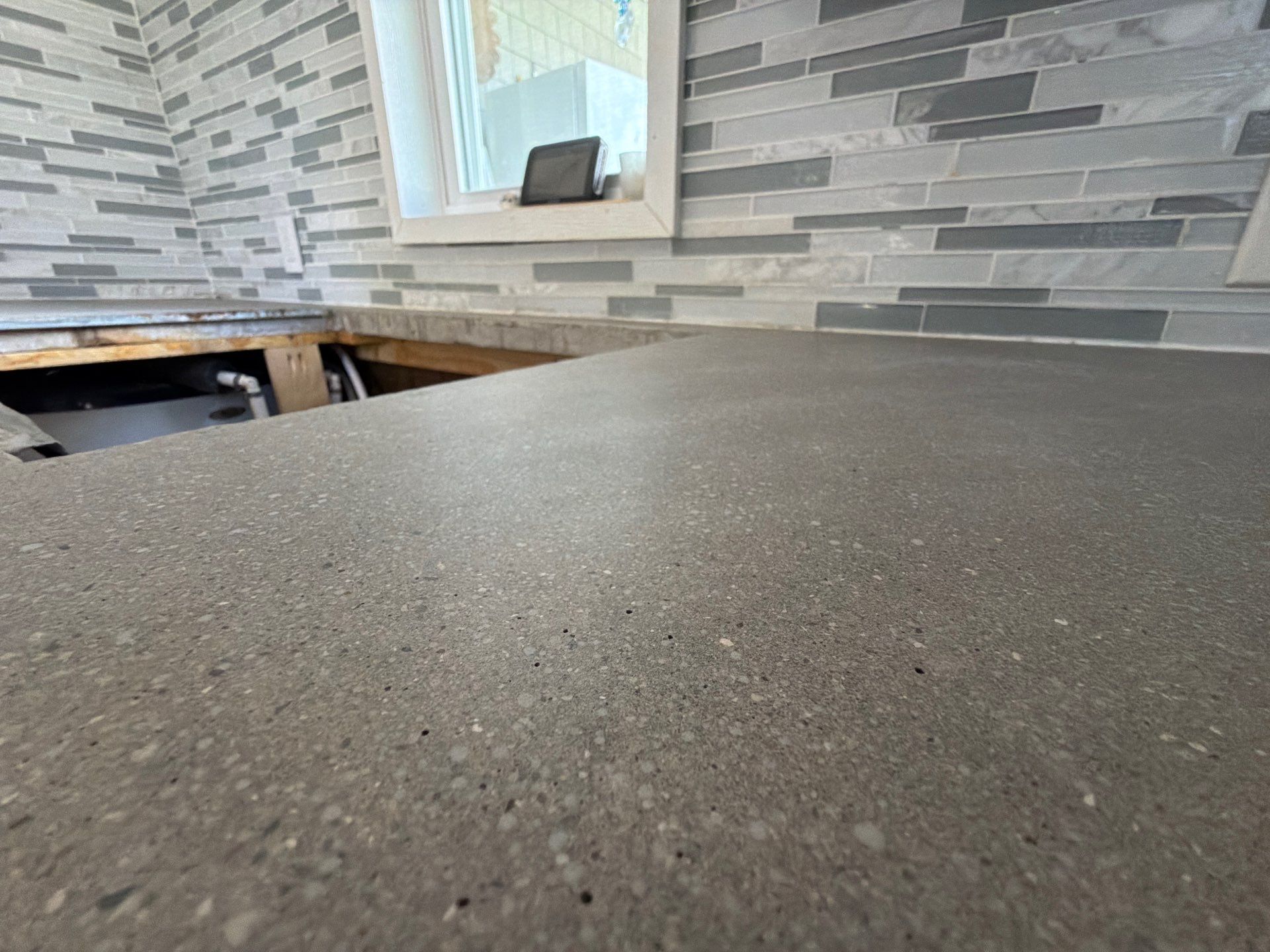 Custom Metallic Epoxy Floor and Polished Countertop Installation in Mears by Gordon Painting