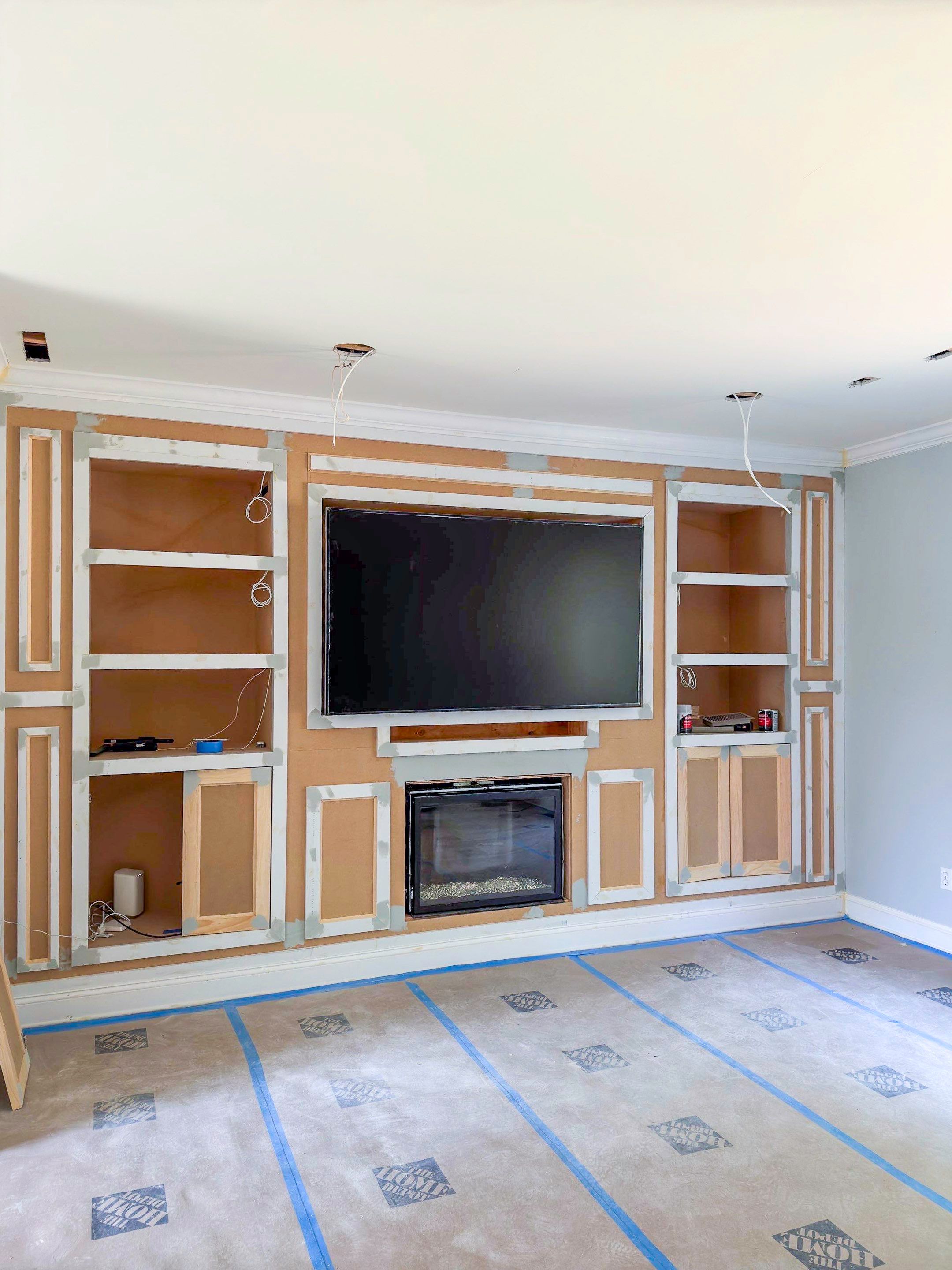 Built-in TV unit by Trendy Walls Inc.