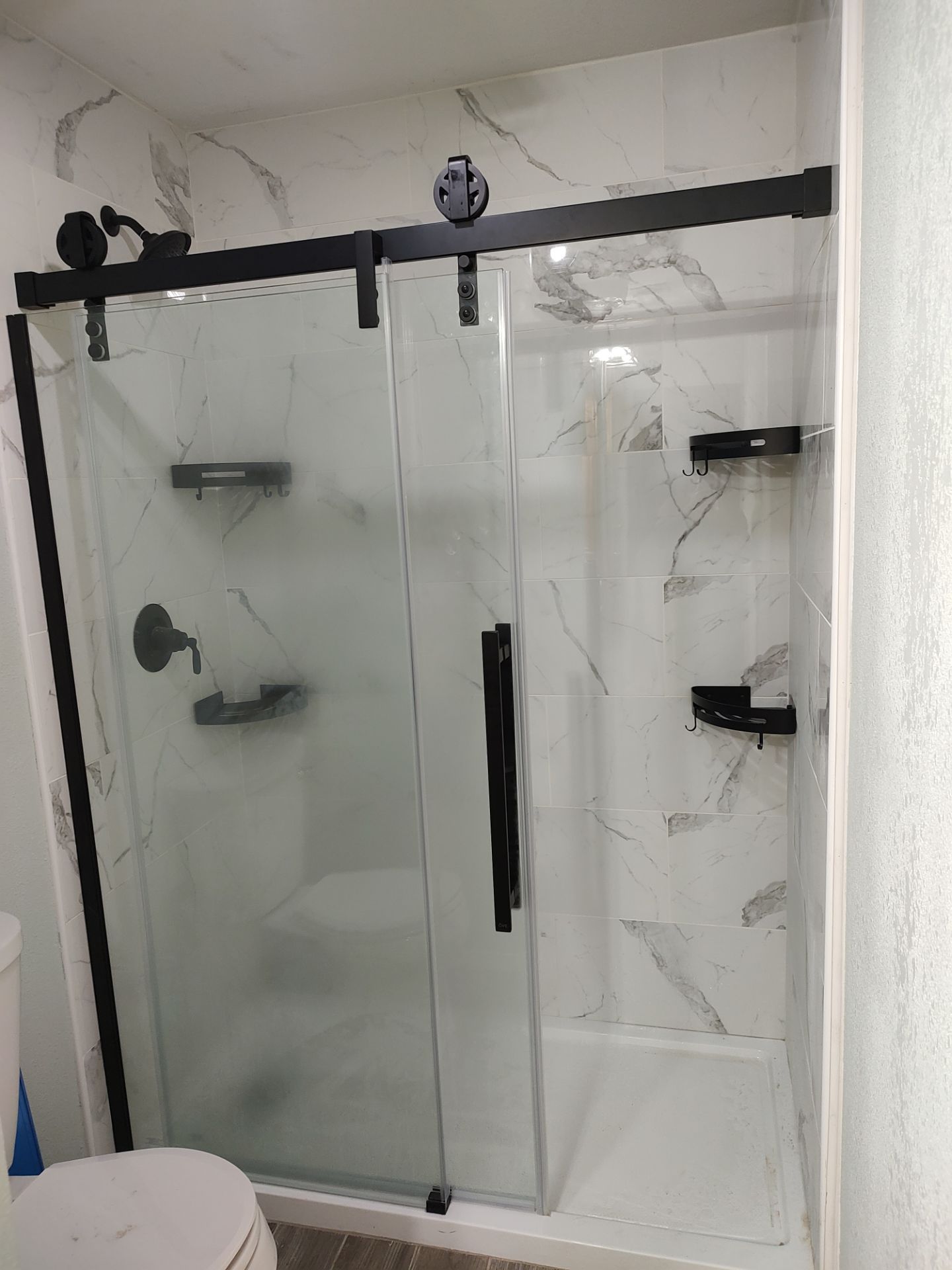 Bathroom remodel w/shower upgrade by In & Out Construction & Remodeling, LLC