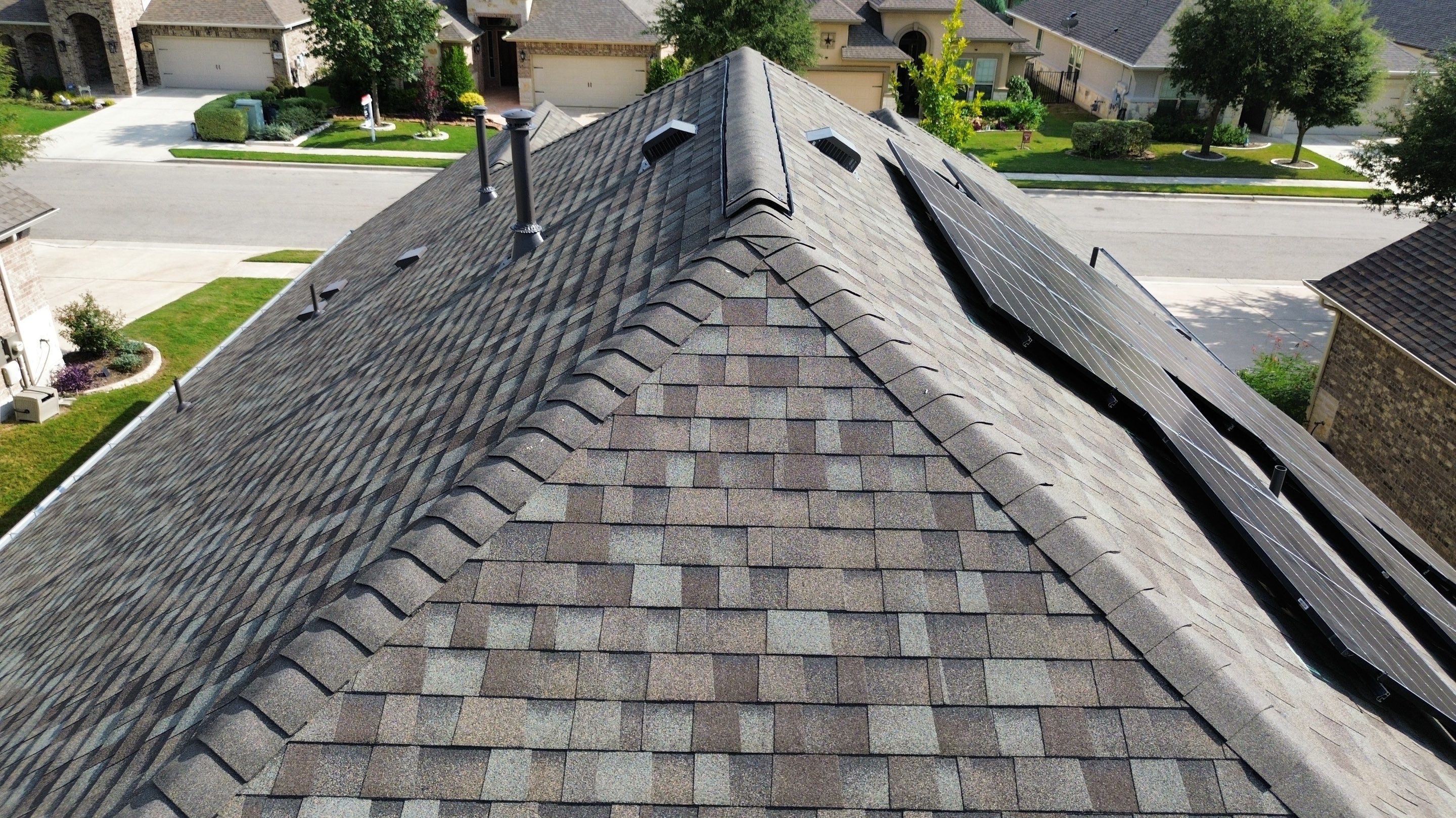 Full Roof Replacement with Solar Reinstall – Duration Driftwood | Round Rock, TX by Kstylez Roofing & Construction