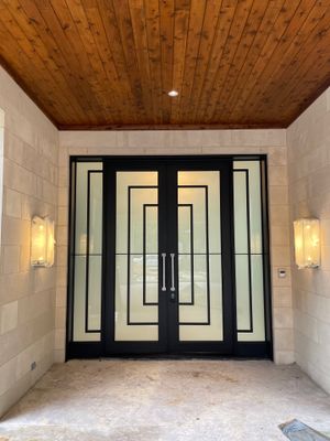 Modern Metal and Glass Entryway Installation with Custom Hardware Finishing in Dallas
