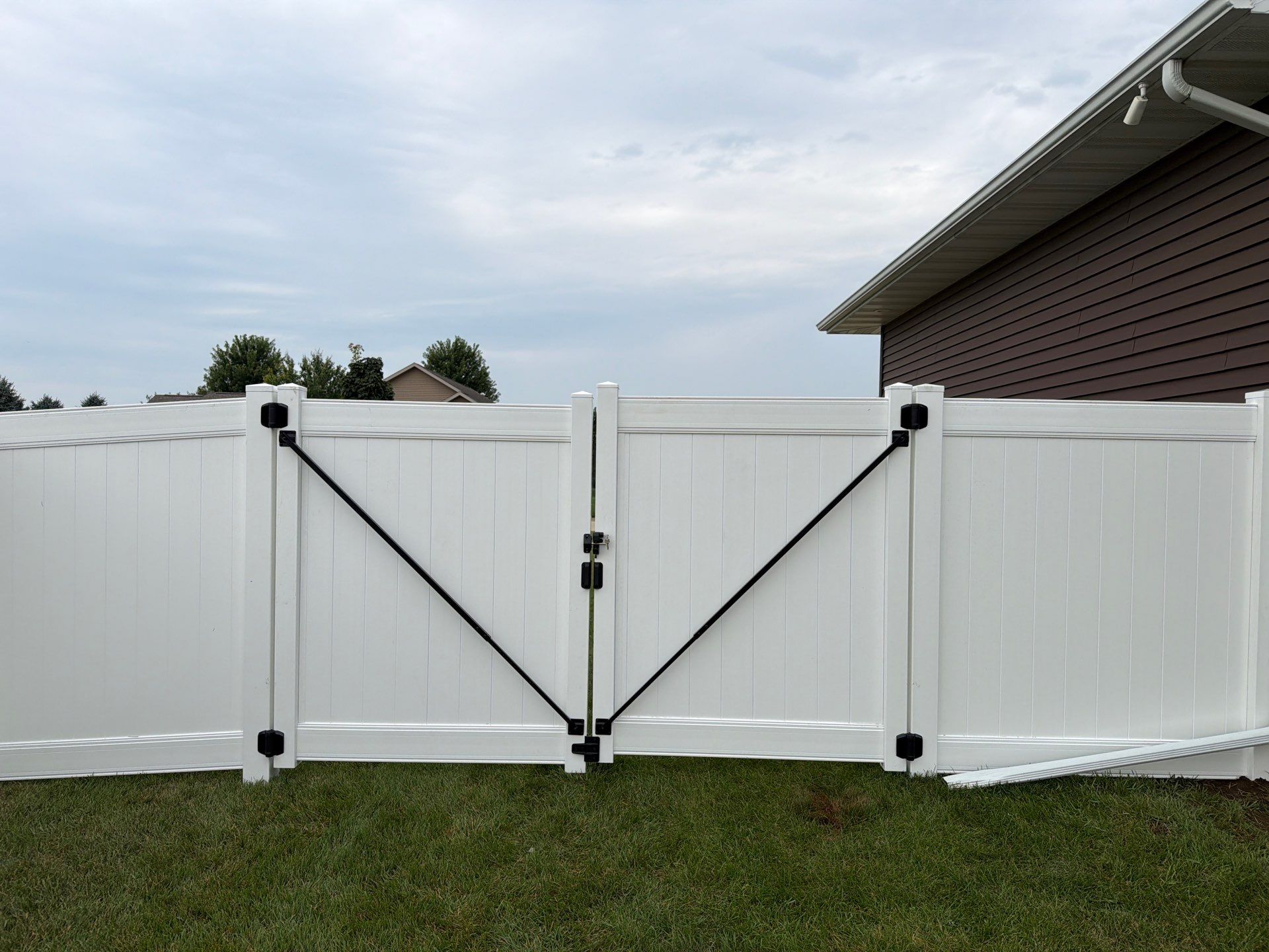 White Vinyl Privacy Fence and Double Gate Installation in Jesup by Perfect Picket Fence and Stain