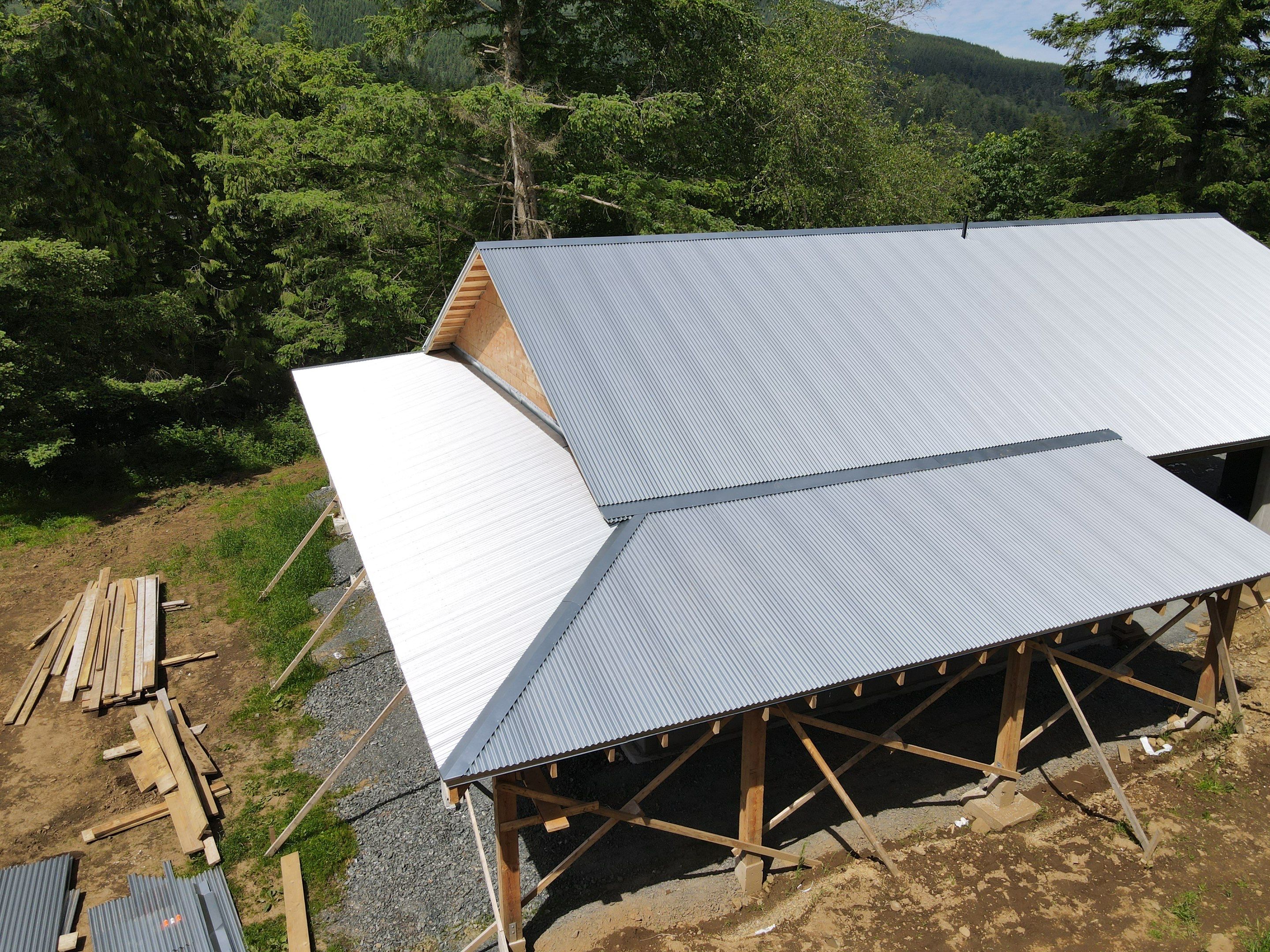 Commercial Roofing Installation using corrugated metal by Top Notch Roofing Inc