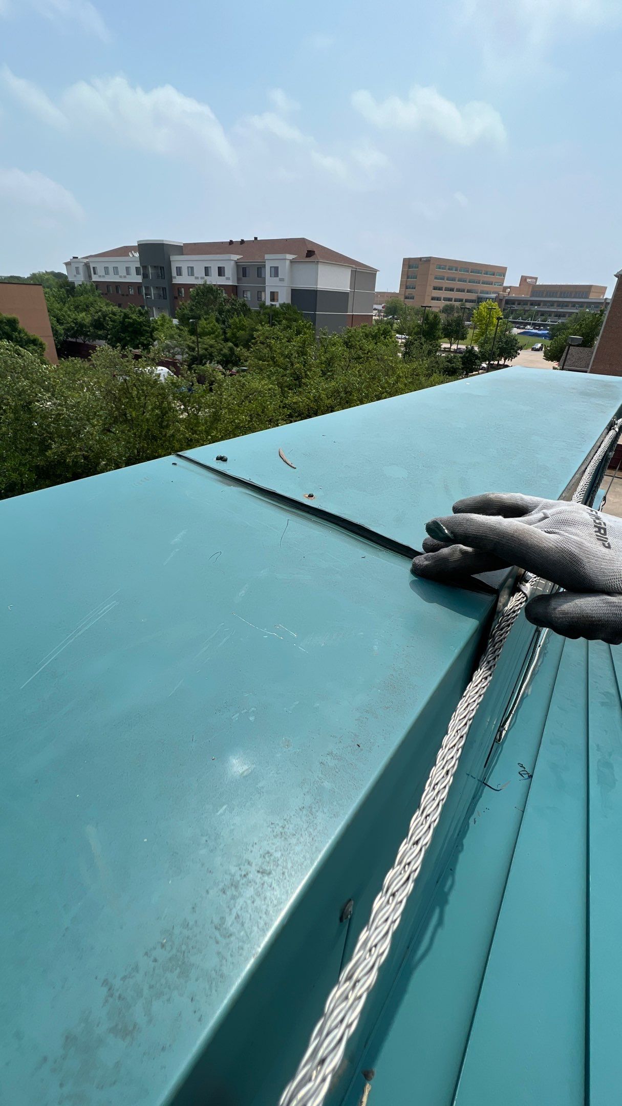 Commercial Roofing Repair using TRP #924 Eterna-Sil Premium Silicone Roof Coating by Harvey Roofing & Construction