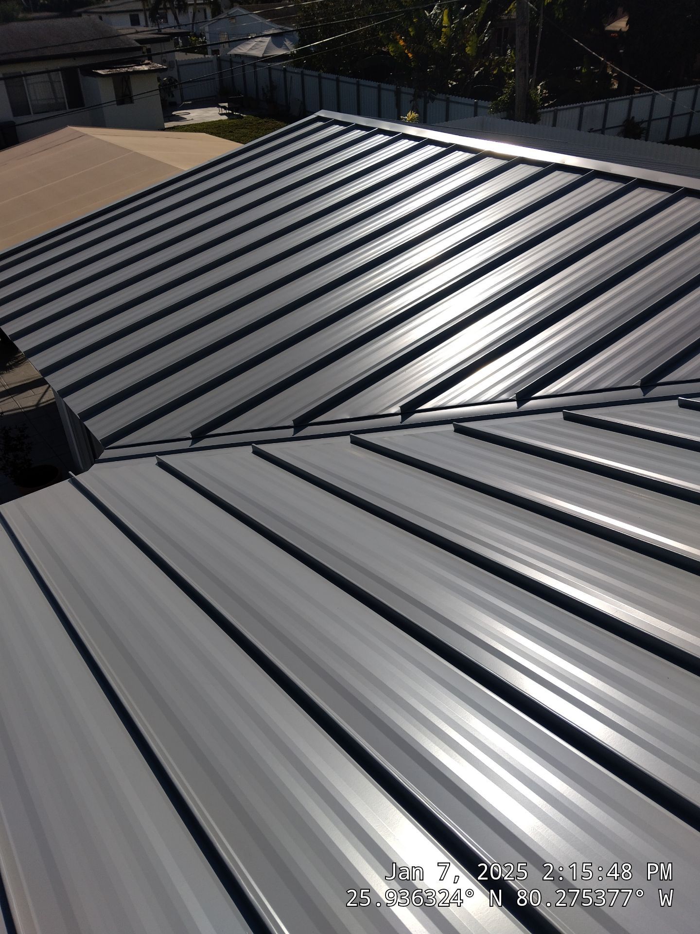RESIDENTAL METAL REROOF 24 GUAGE DOVE GRAY 1-1/2" MECHANICAL SEAM METAL POLYGLASS POLYSTICK XFR by Earl W. Johnston Roofing 