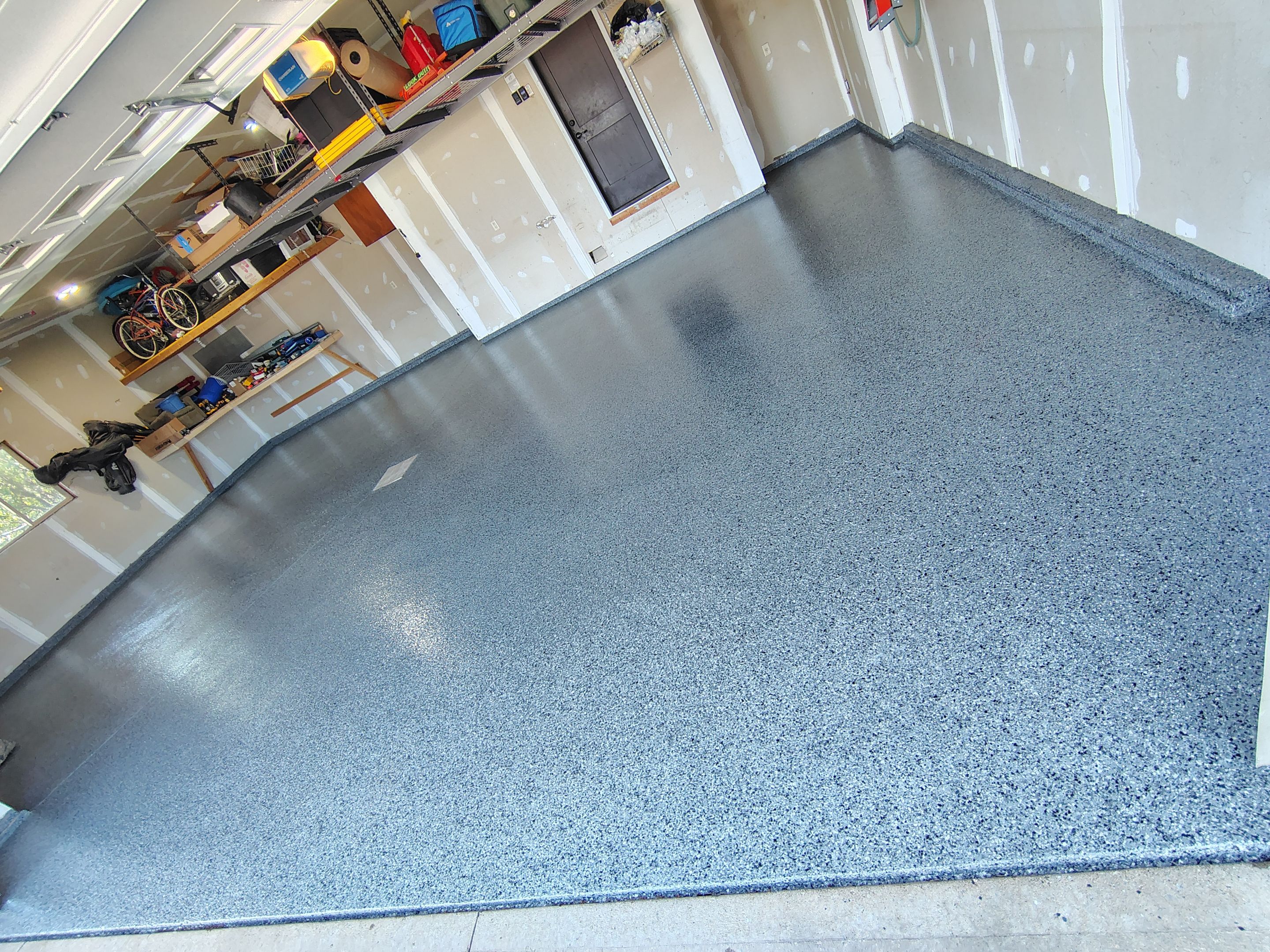 Sioux Falls Garage Concrete Grinding and Nightfall Decorative Chip Coating by Select Painting, Coatings & Garage Cabinets
