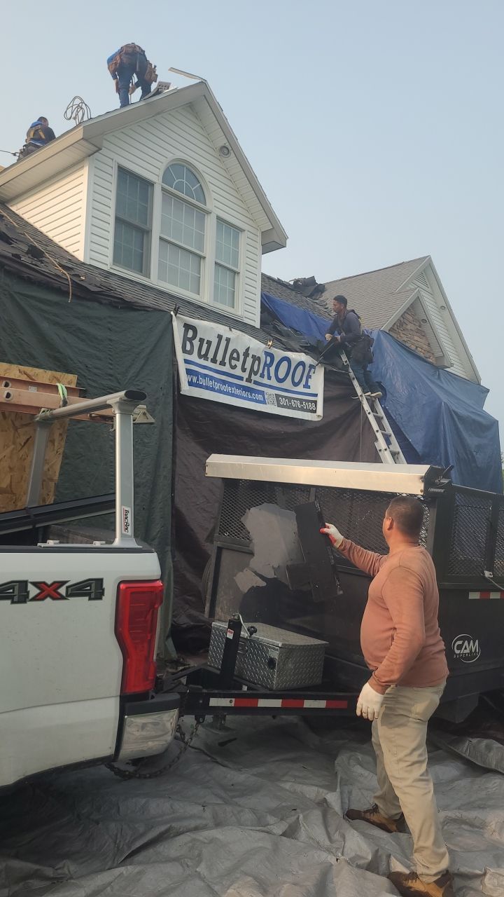 Roof Damage using Certainteed Lifetime Roofing System- Moire Black Landmark Pro shingkes with shadow ridge caps. by BulletpROOF Exteriors