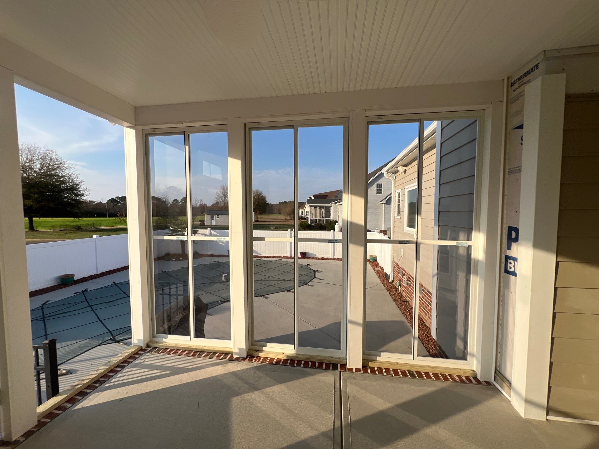 Custom Screened Porch and Concrete Walkway Installation in Rocky Mount by The Remodeling Company