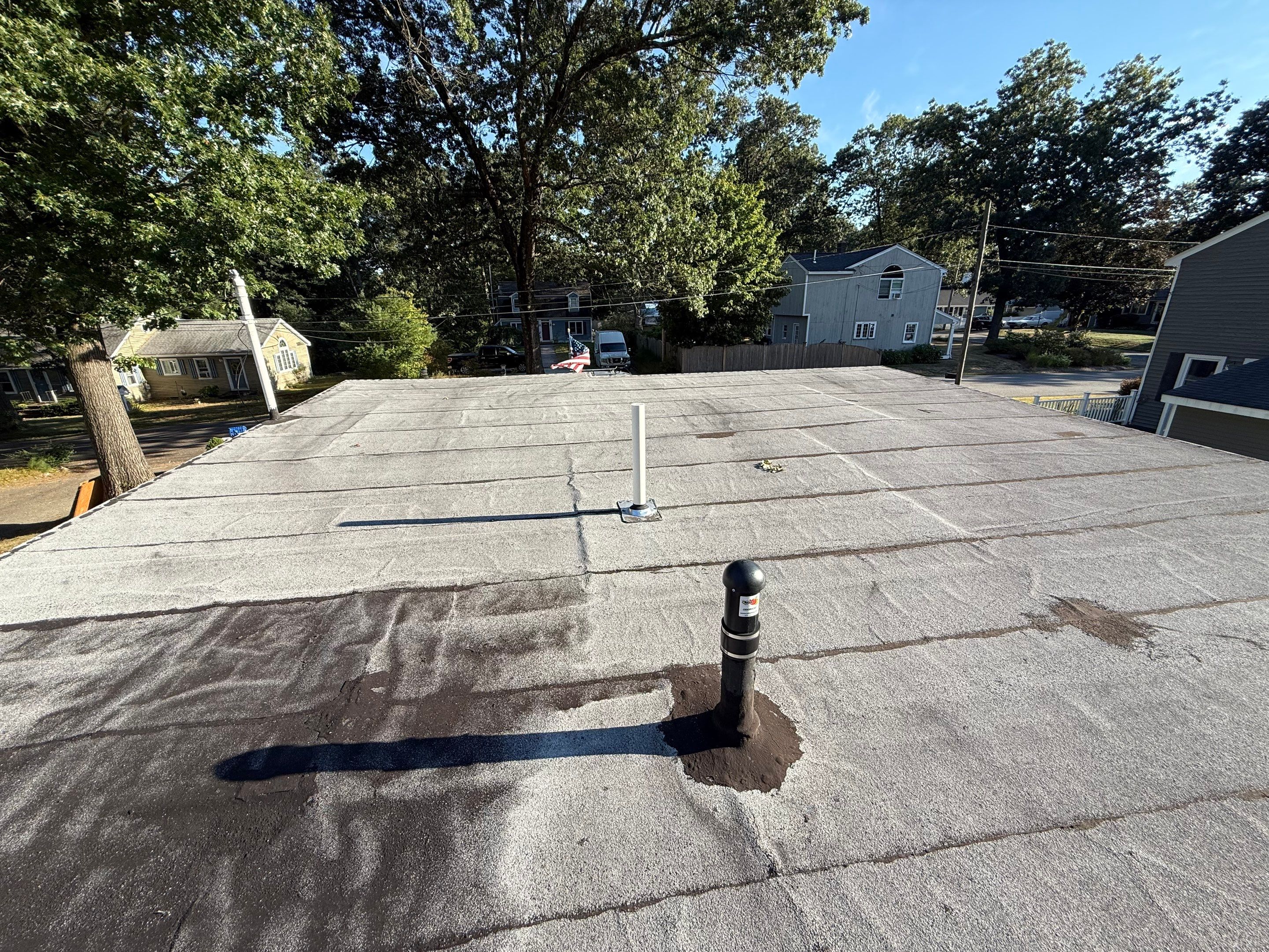 Westford EPDM Flat Roof with Gutter & Soffit/Fascia Replacement by Mighty Dog Roofing of Greater Middlesex County