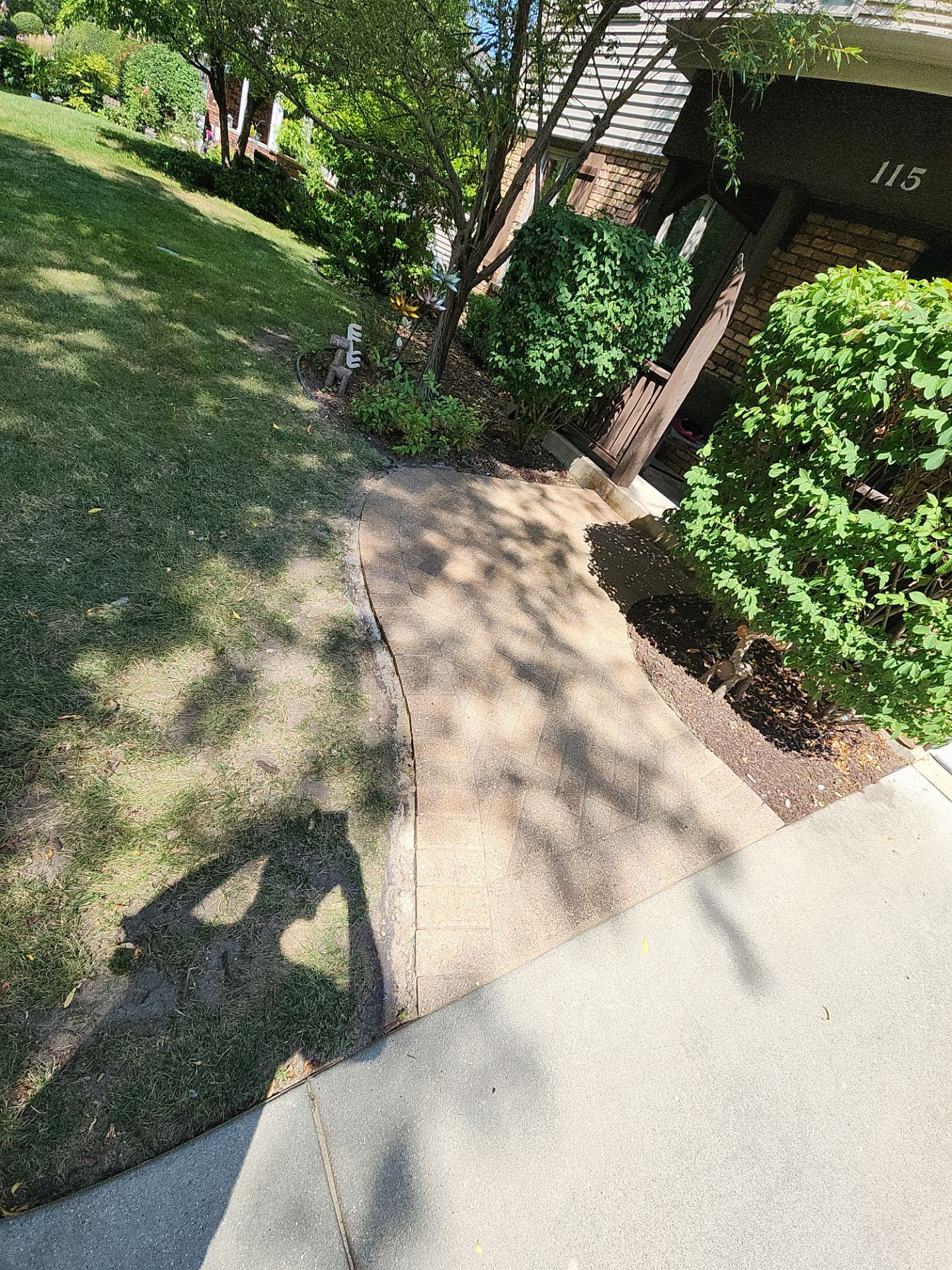 Arlington Heights Brick paver repair, cleaning and sealing by Northern Power Washing LLC.