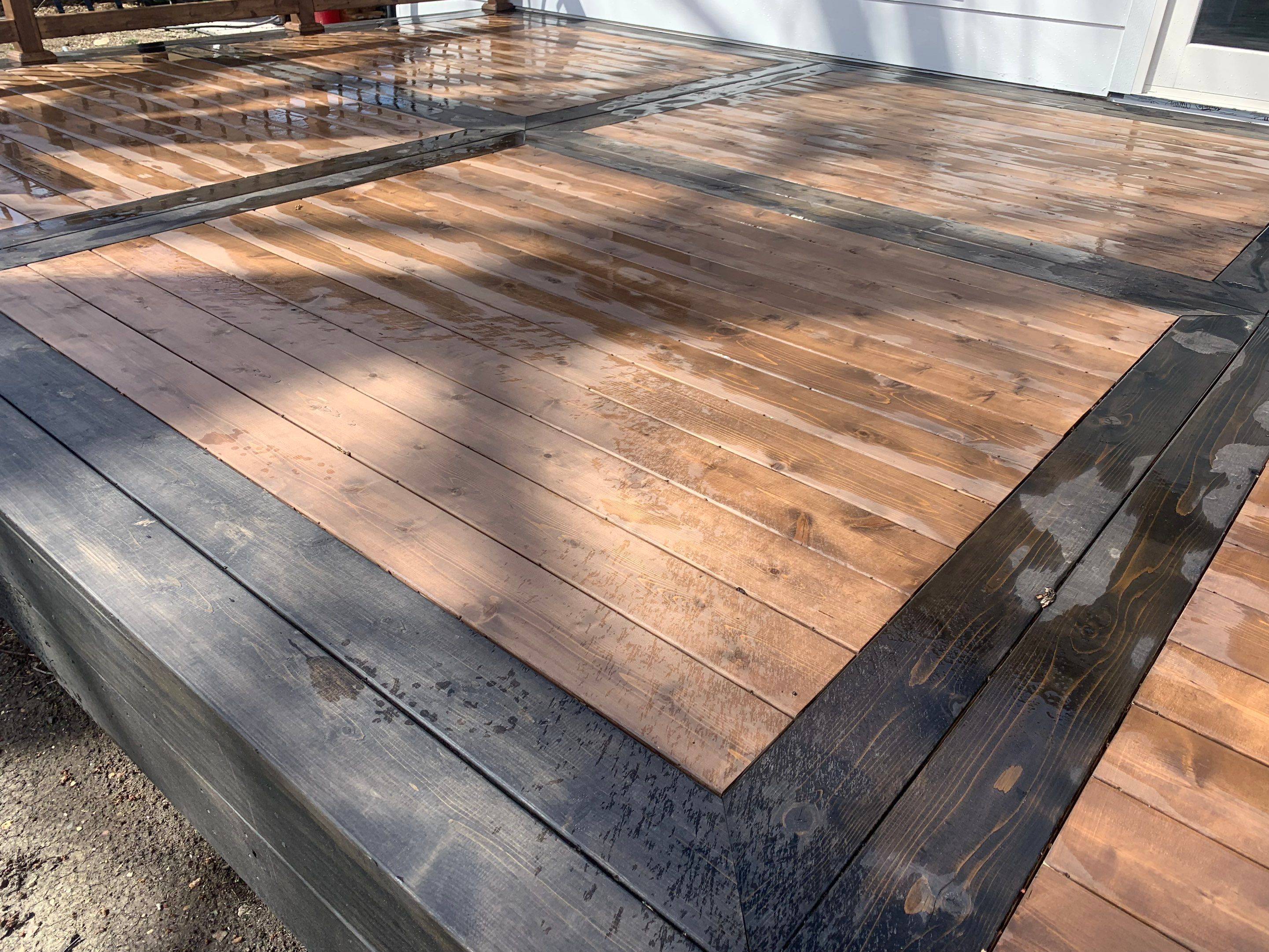 Deck re stained  by Cutting edge painting 