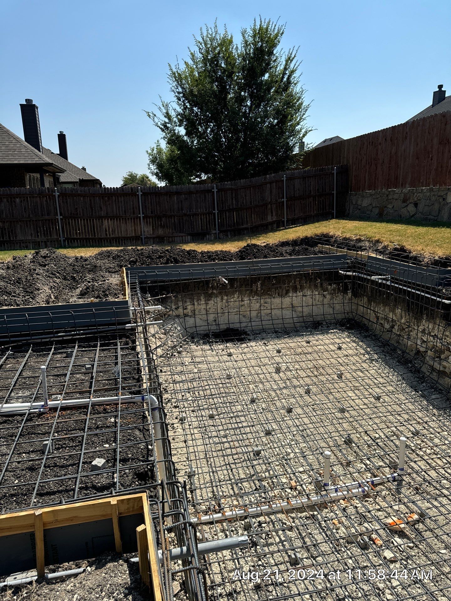 Modern Geometric Pool with Raised Stone Wall and Paver Deck by Pinnacle Pools and Spas - DFW