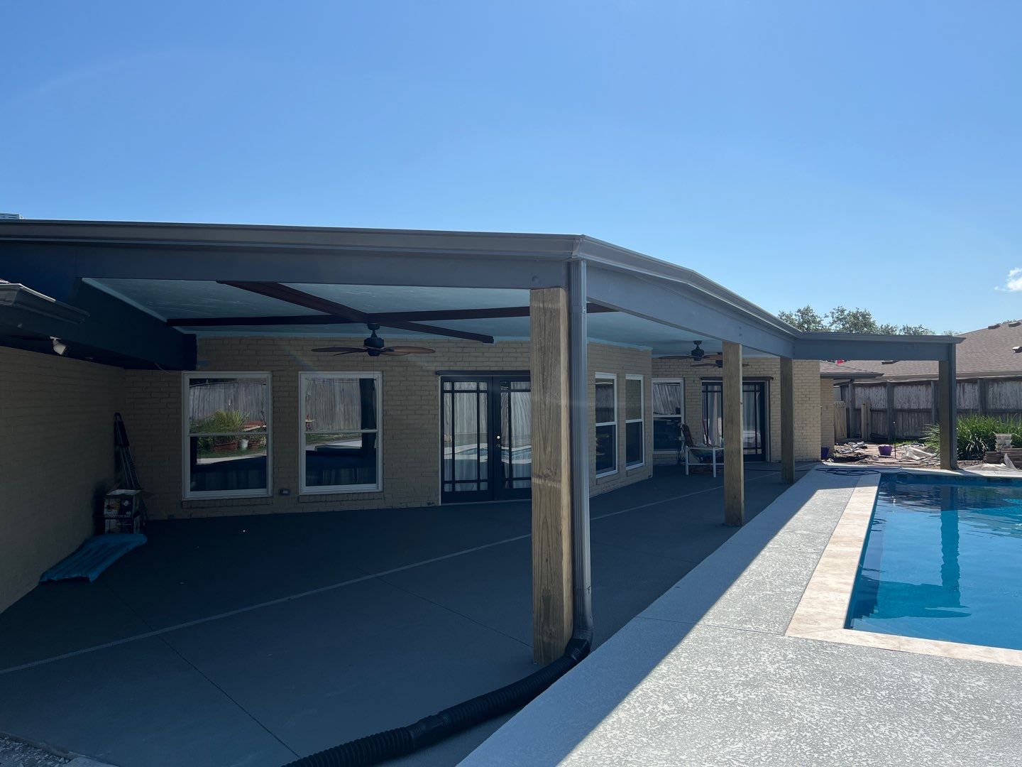 Beautiful pool side build by Bayfront Roofing and Construction