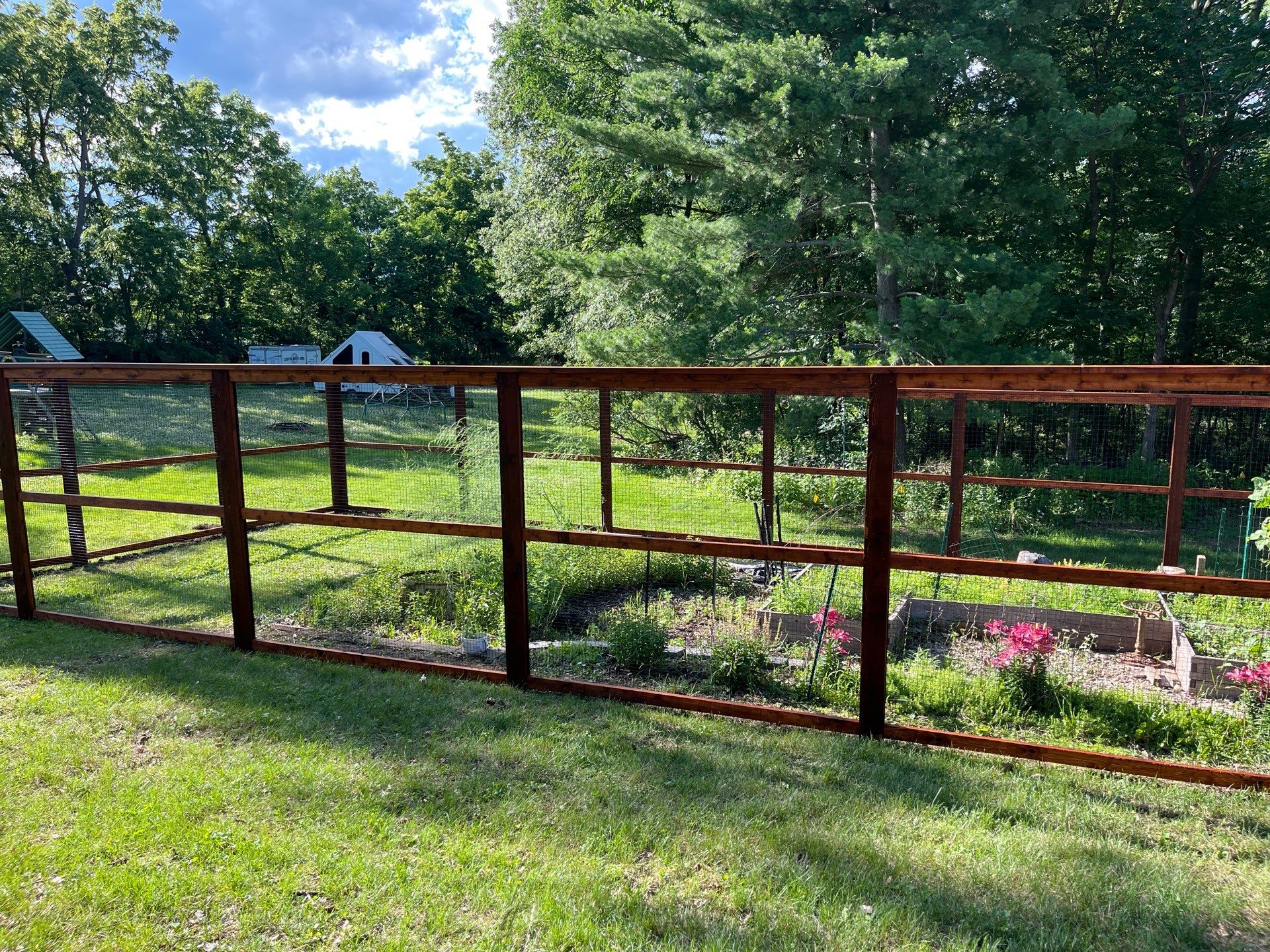 Stained Cedar Mahogany Garden Fence and Raised Bed Enclosure in Cedar Falls by Perfect Picket Fence and Stain