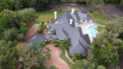 Residential Roofing Installation using 1" Nail strip metal roof